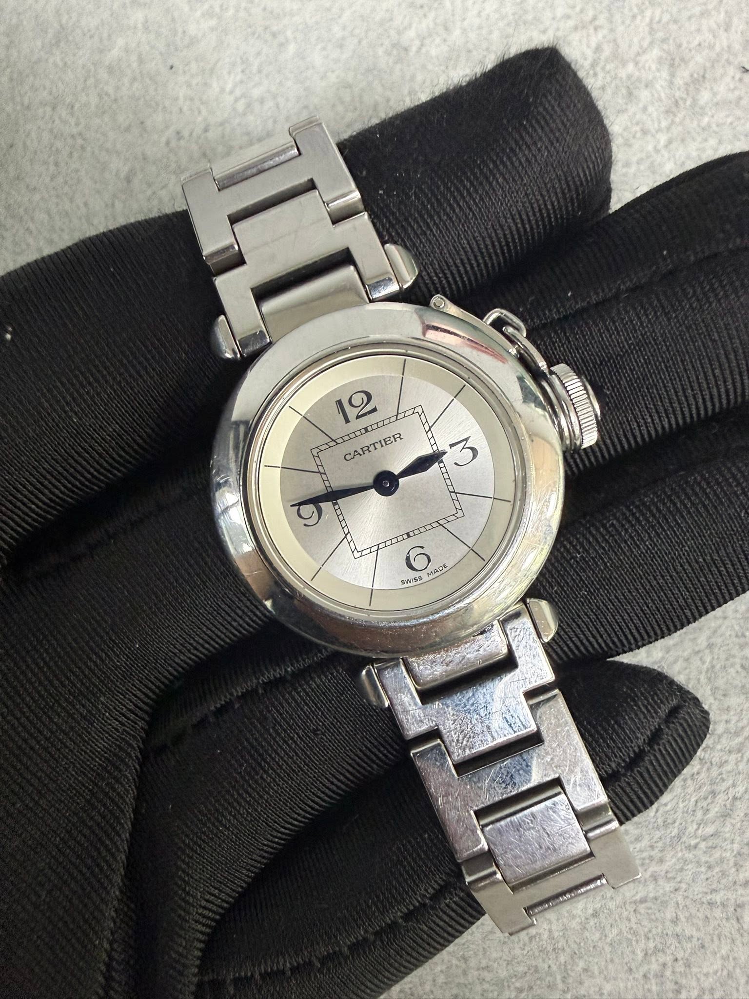 May be an image of wrist watch and text
