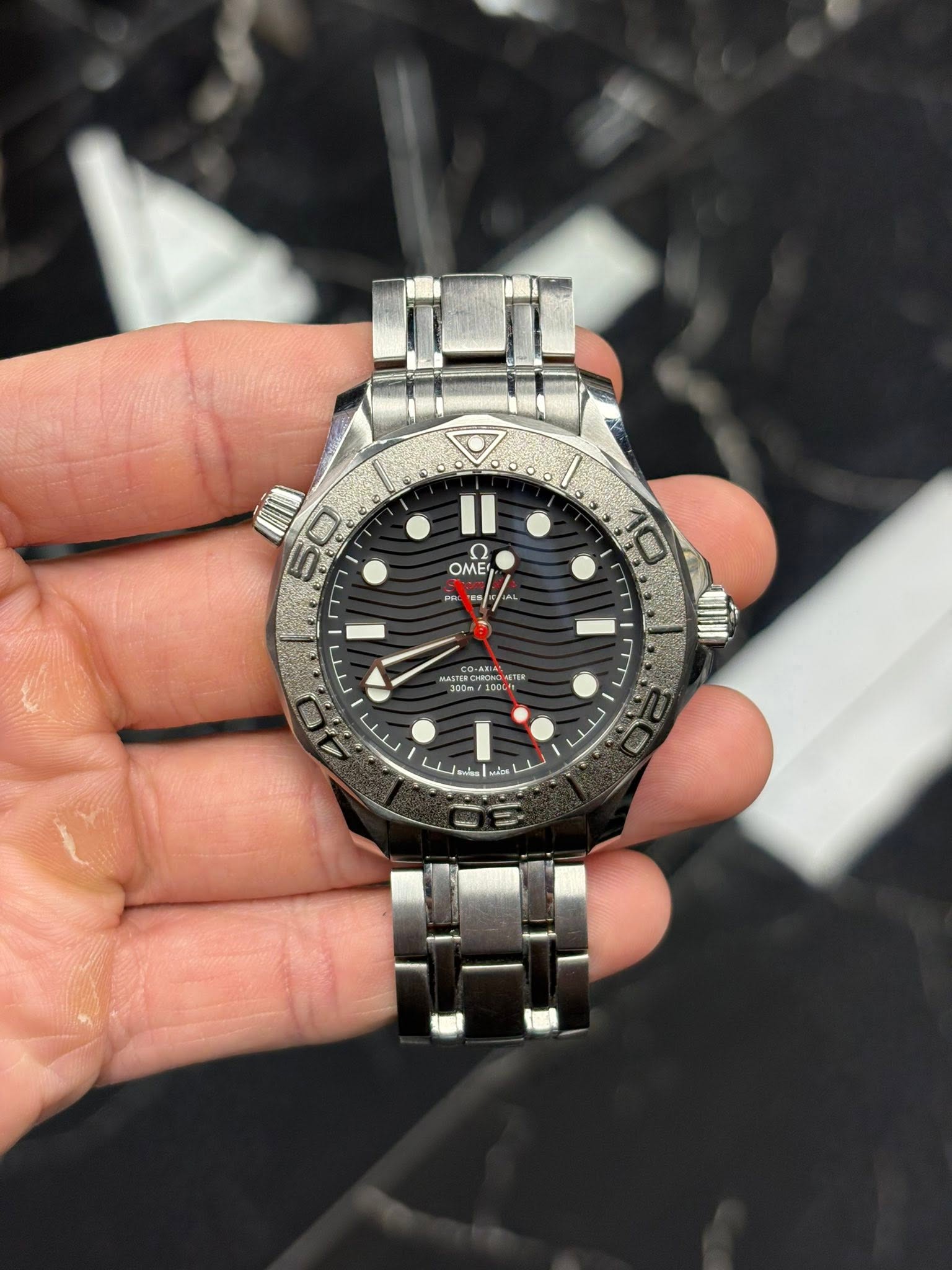 May be an image of wrist watch and text
