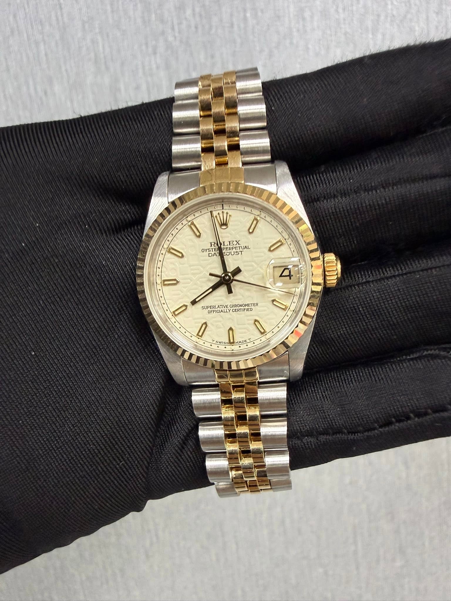 May be an image of wrist watch and text