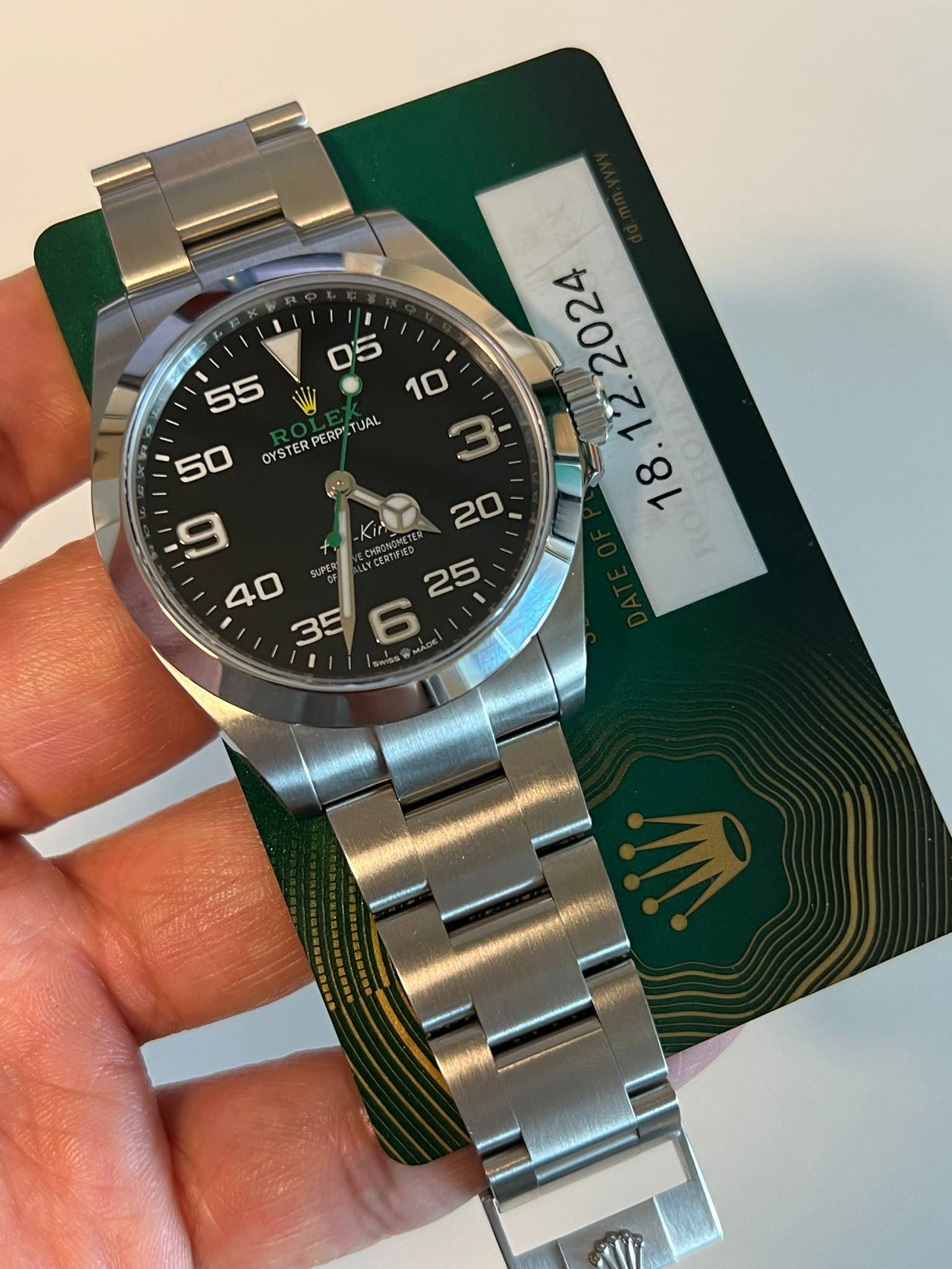 May be an image of wrist watch and text