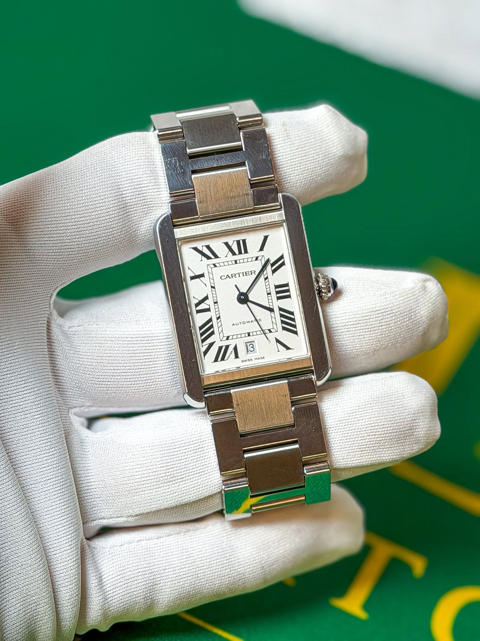 May be an image of wrist watch and text