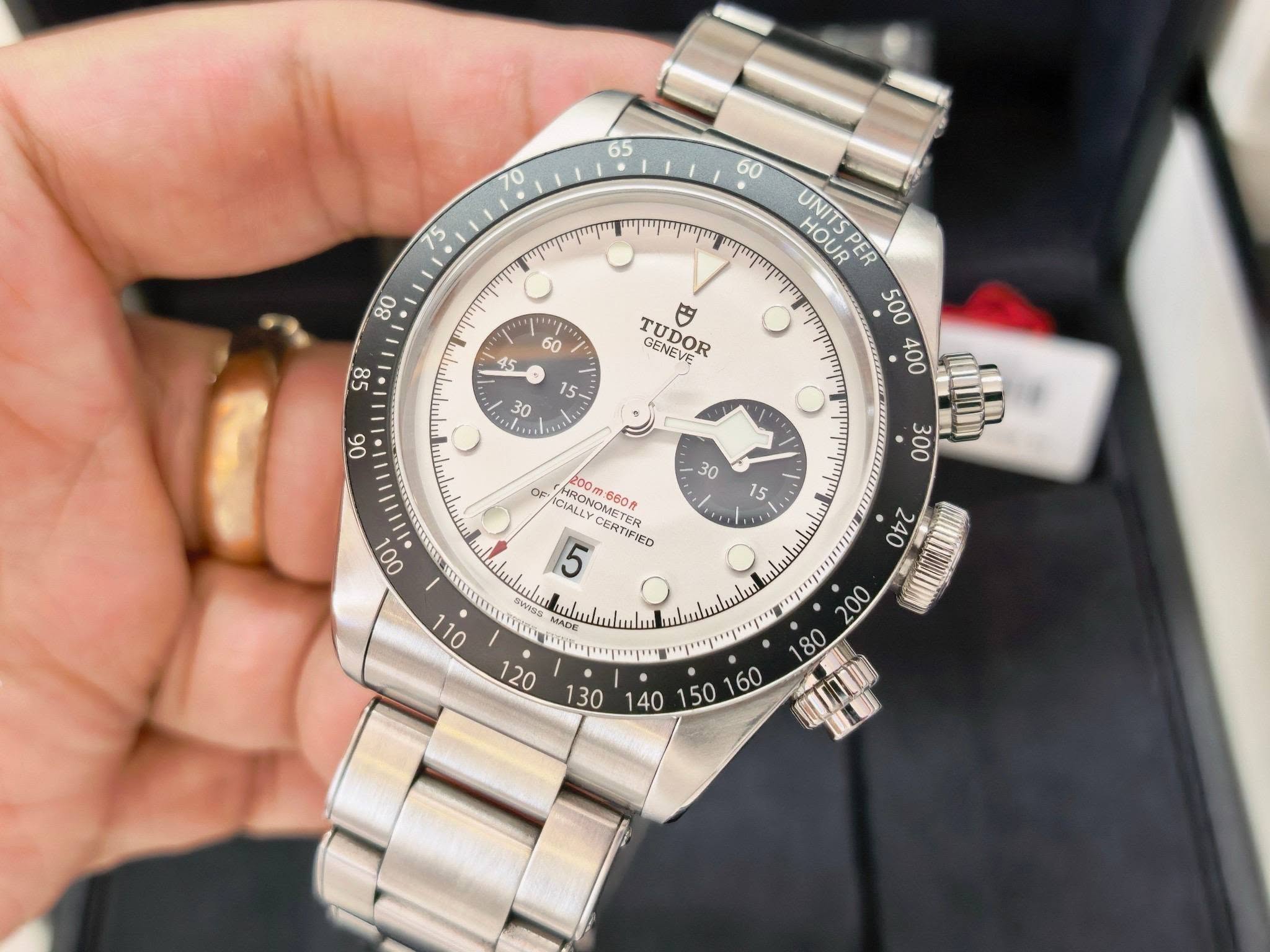 May be an image of wrist watch and text