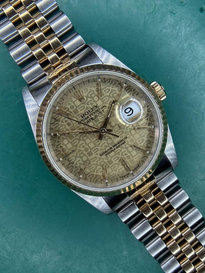 May be an image of wrist watch and text