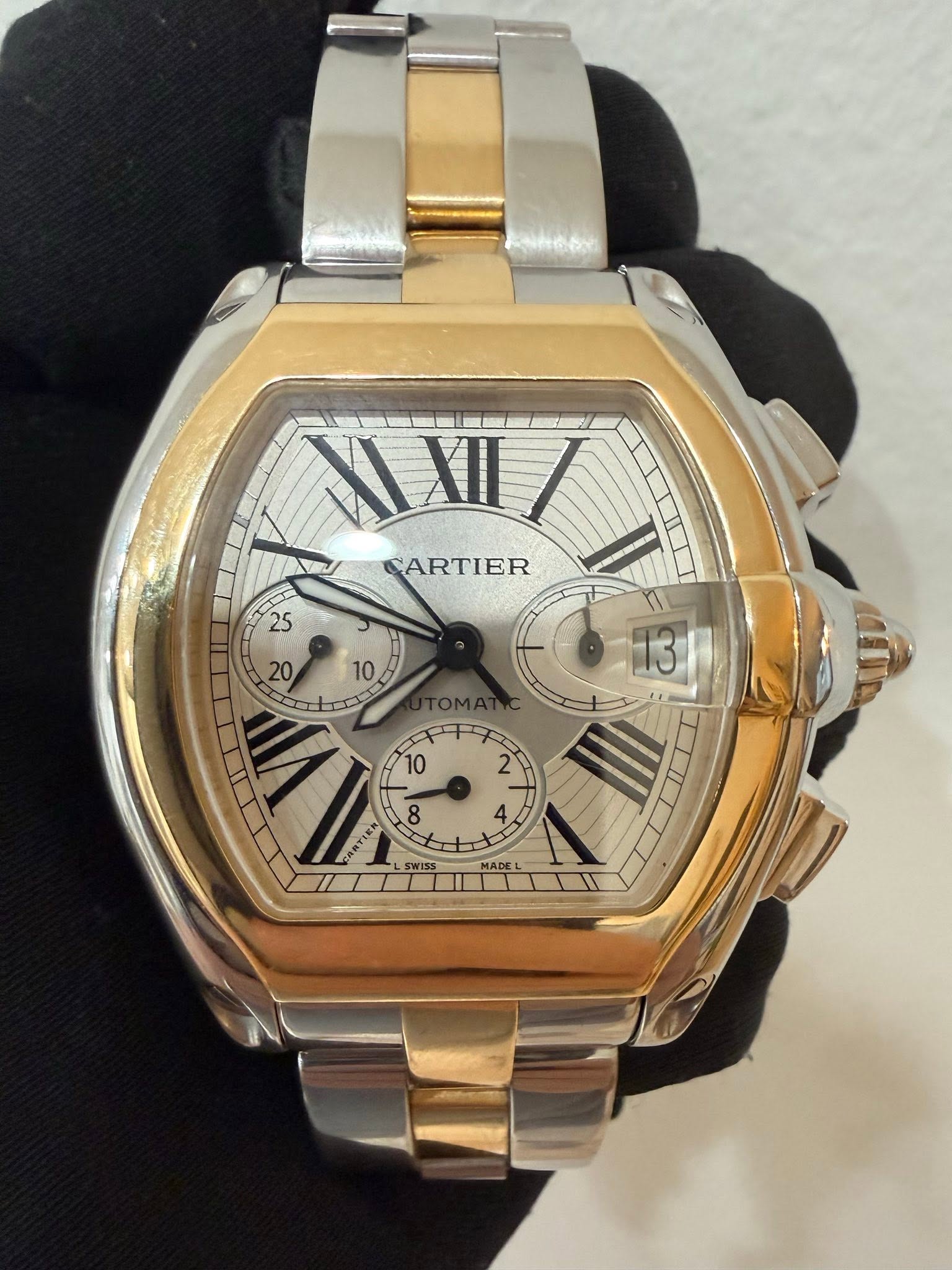 May be an image of wrist watch and text