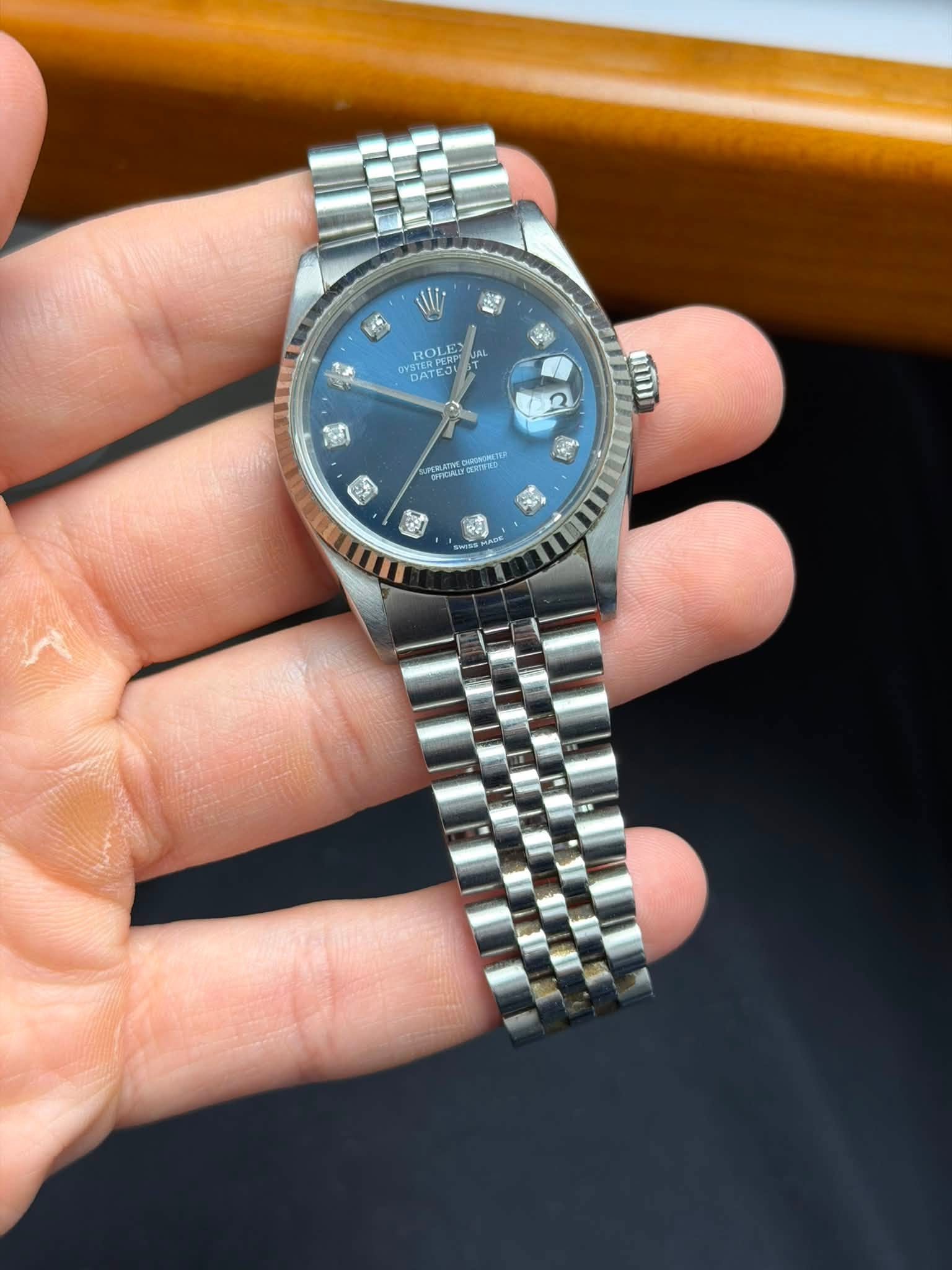 May be an image of wrist watch and text