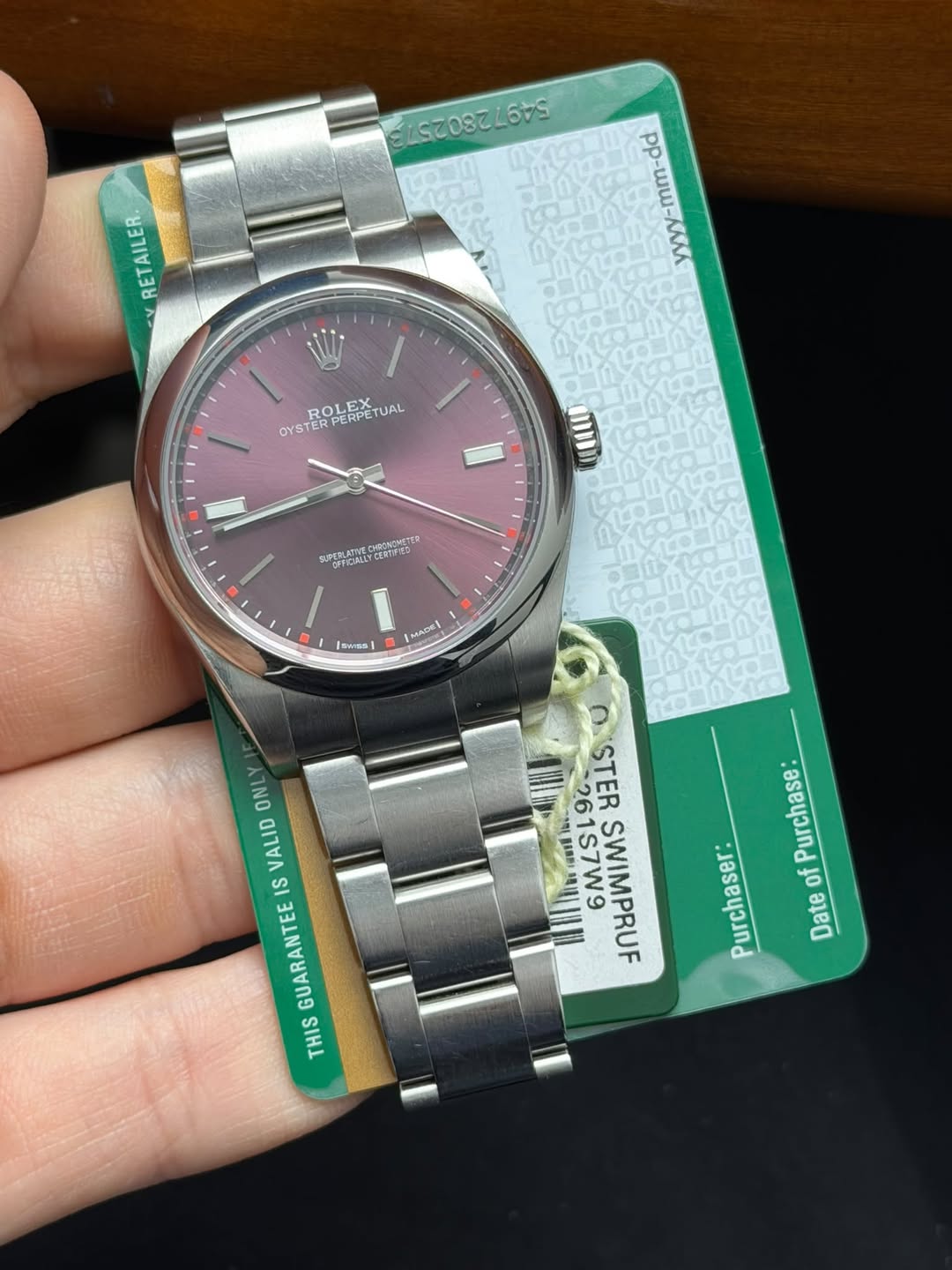 May be an image of wrist watch and text