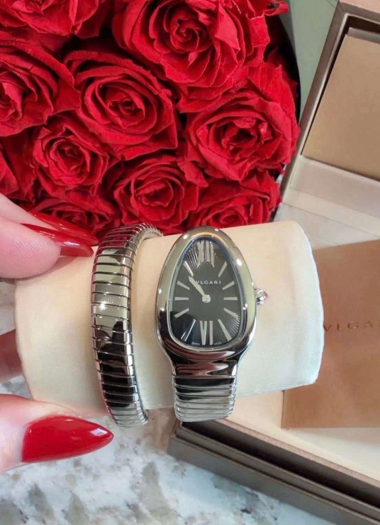 May be an image of wrist watch and text