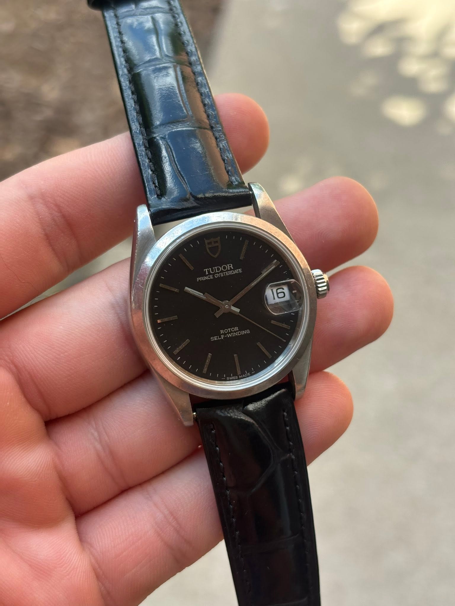 May be an image of wrist watch and text