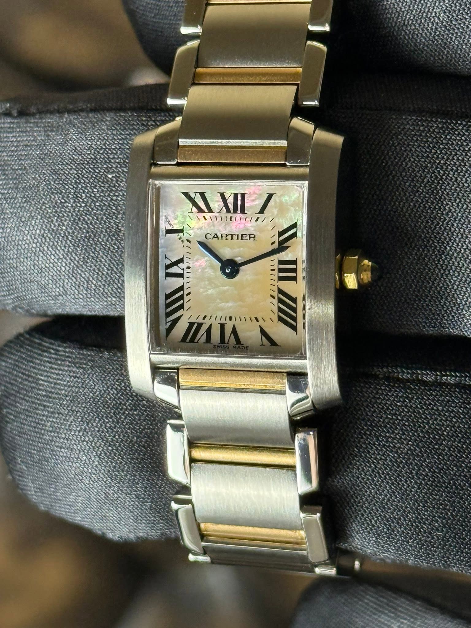 May be an image of wrist watch and text