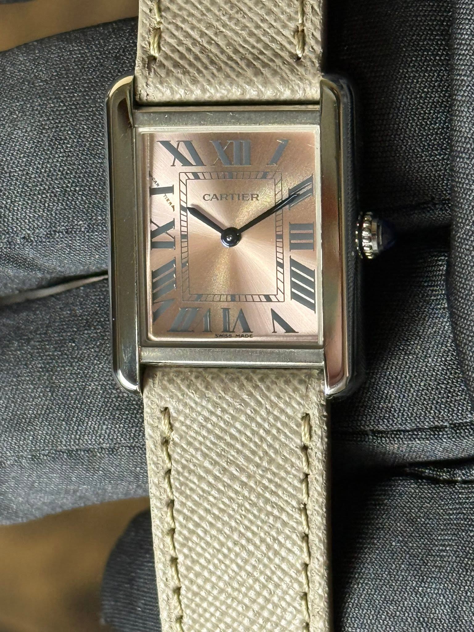 May be an image of wrist watch and text