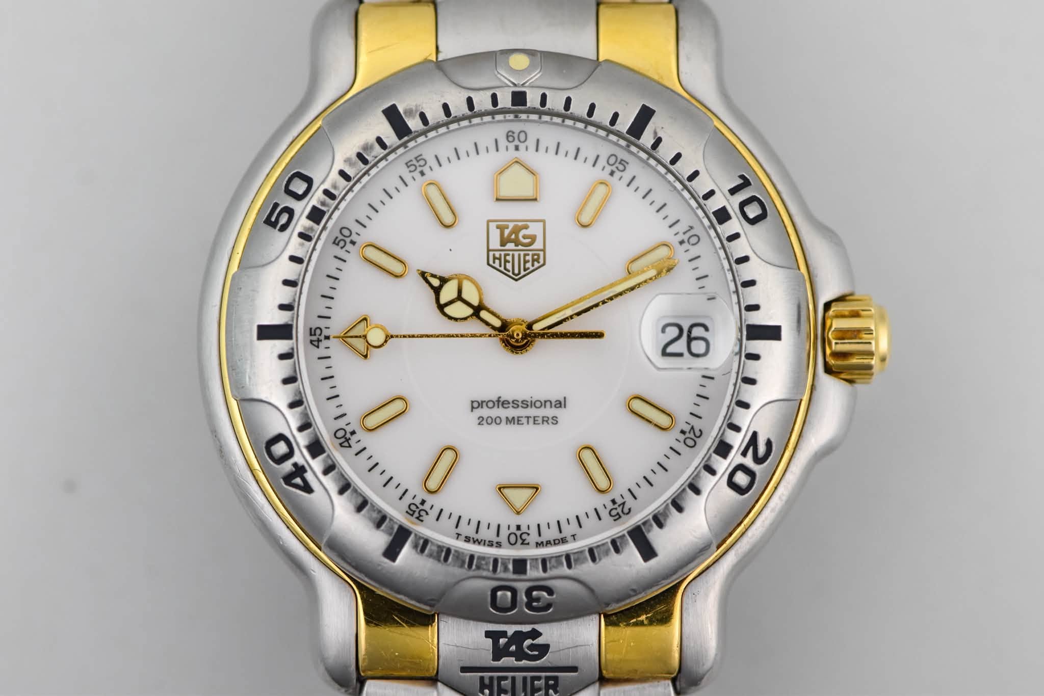 May be an image of digital watch and text that says ' O 50 0 T4G 0 HEJER HETER professional O 70 N 20 40 הליויויויונ' ויויוי 40 - 200METERS 200 METERS 0 O 2 SWISS 30 MADE DE…