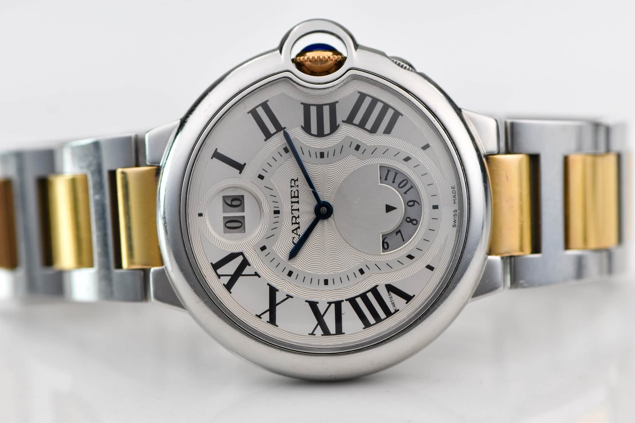 May be an image of wrist watch and text that says 'mE 110 o MAAE E SSIMS U । III I 06 ARTIER X 一ミ 0 I VIT 23 หนาท 4'