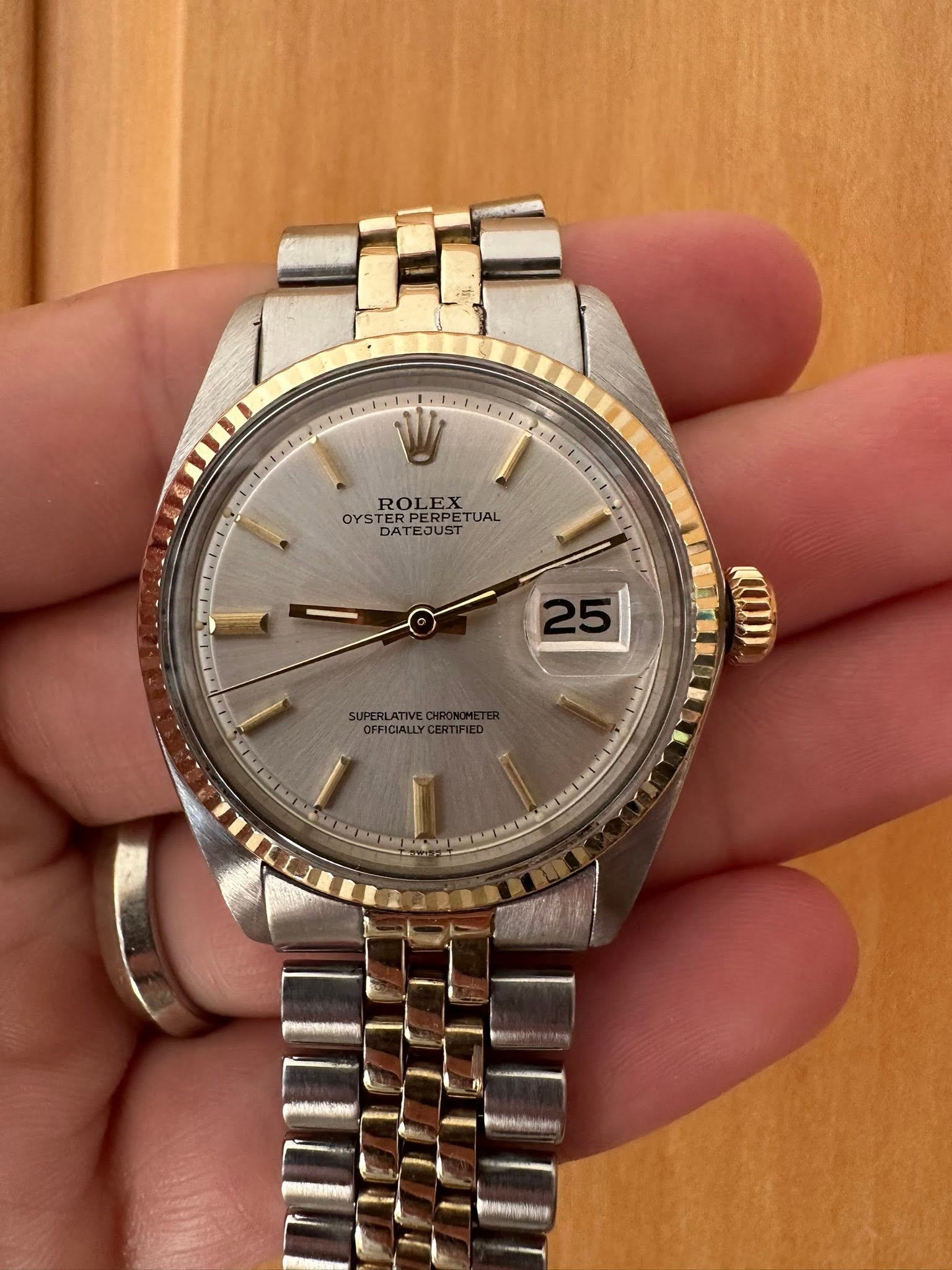May be an image of wrist watch and text