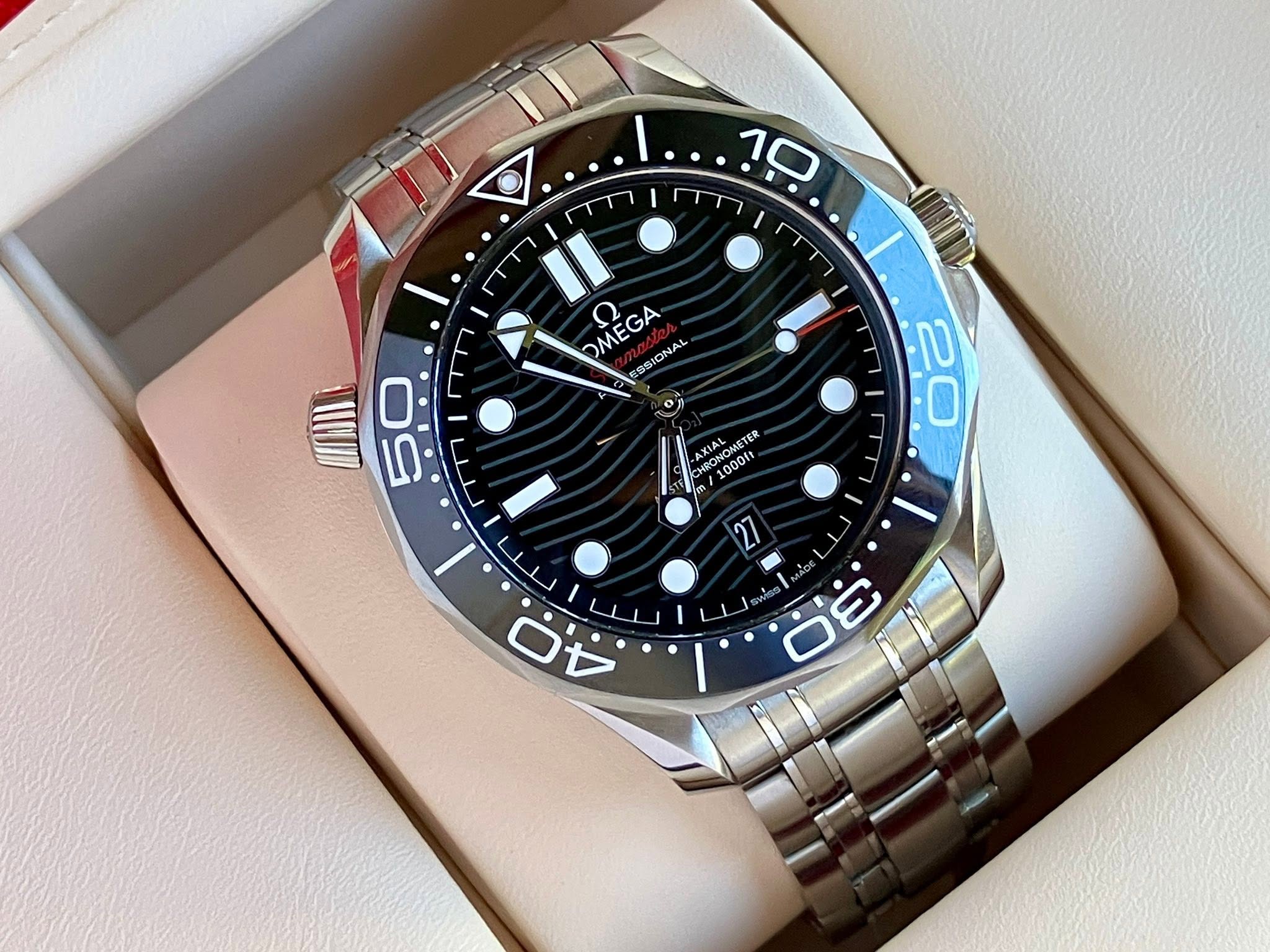 May be an image of wrist watch and text that says 'n 10 II GA OMEGA ME ESSIONAL BONGRSTER TER 1000ft OOOf / כח n O 20 50 O 5 س I ن A 27 / 0 0 80 3'
