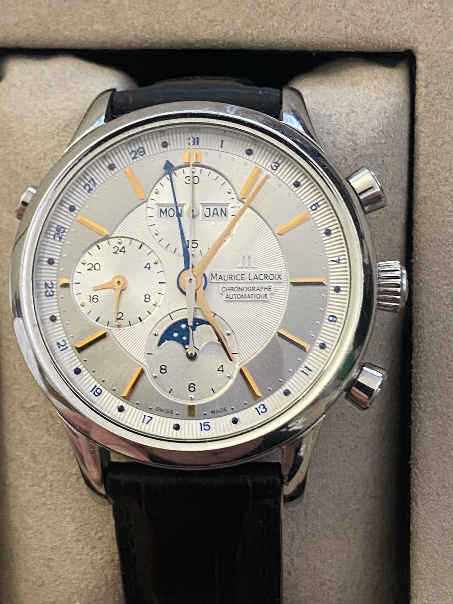 May be an image of wrist watch and text that says ' MOW MOMJAN ن JAN MAURICELACROIX MAURICE LACROIX CHRONOGRAPHE RAPHE AUTOMATIQUE AUTOMA QUE 2 ट မ SWISS MADE ज 13'