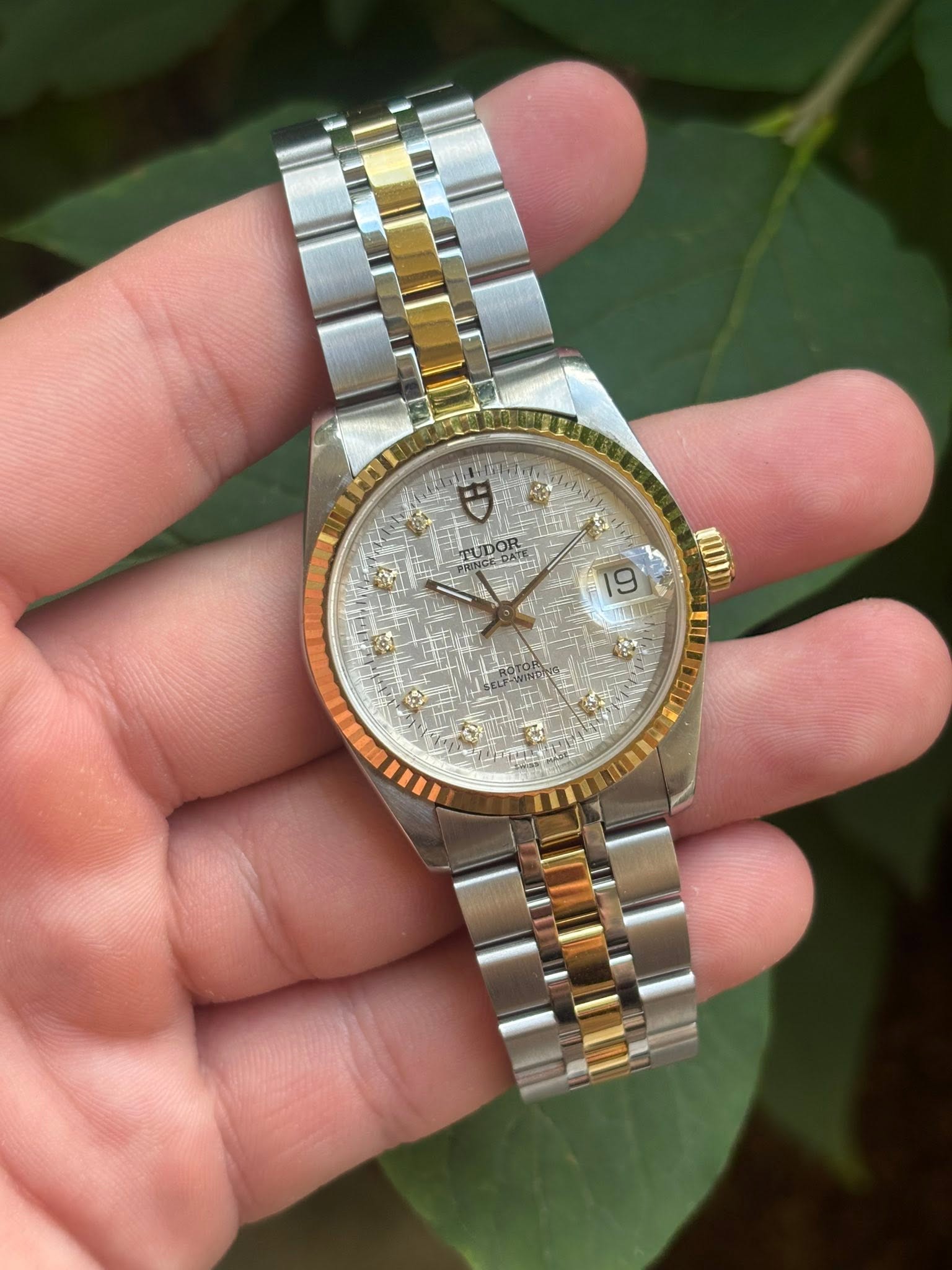 May be an image of wrist watch and text