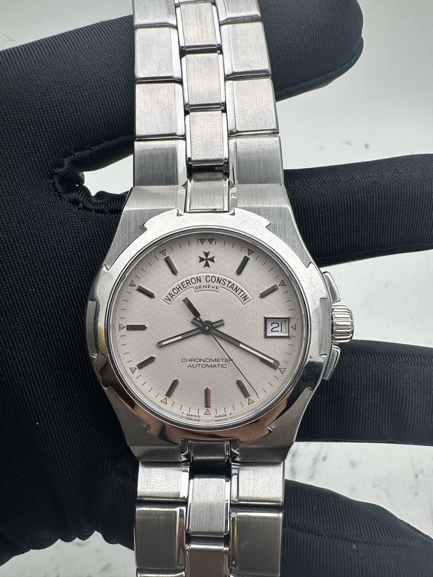 May be an image of wrist watch and text