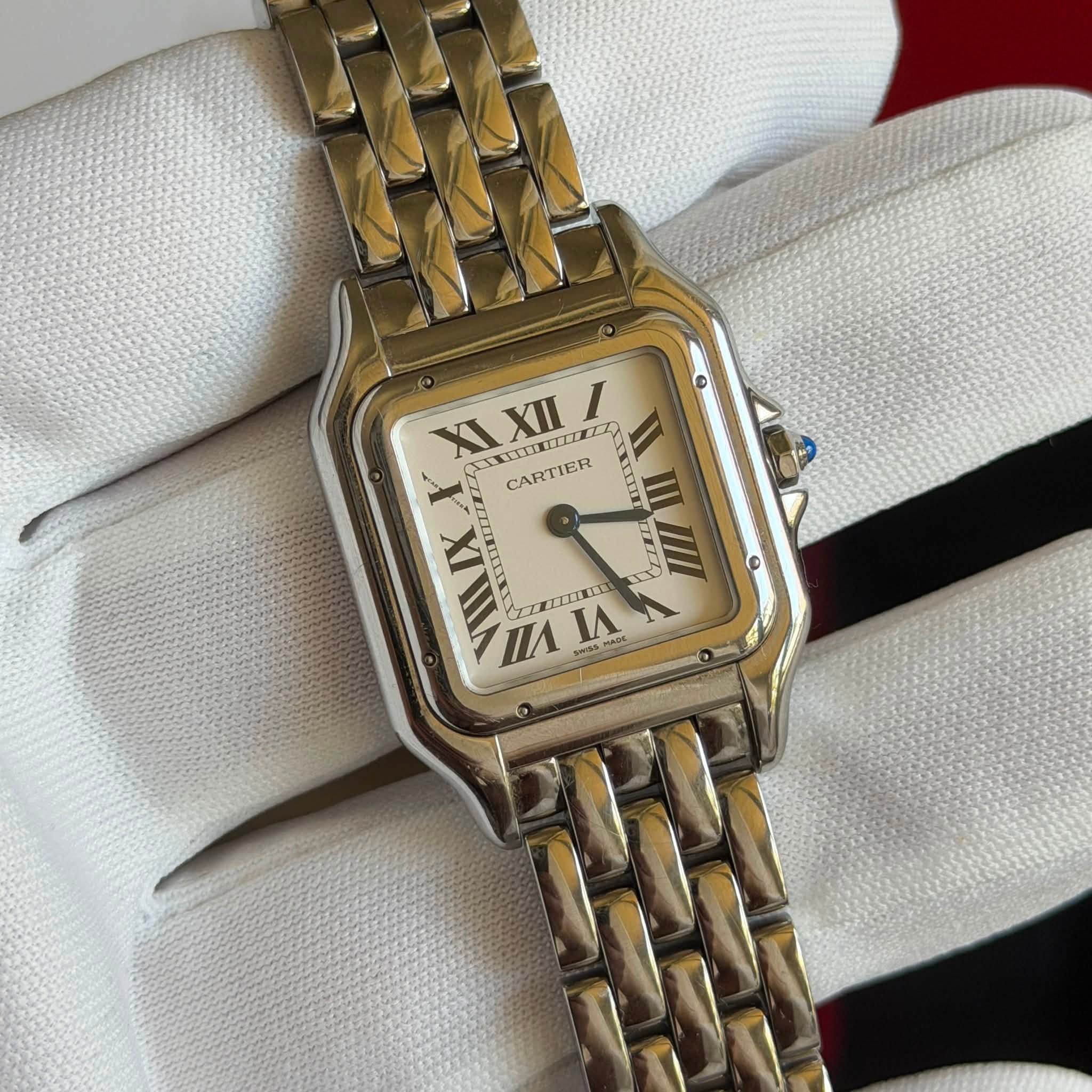 May be an image of wrist watch and text