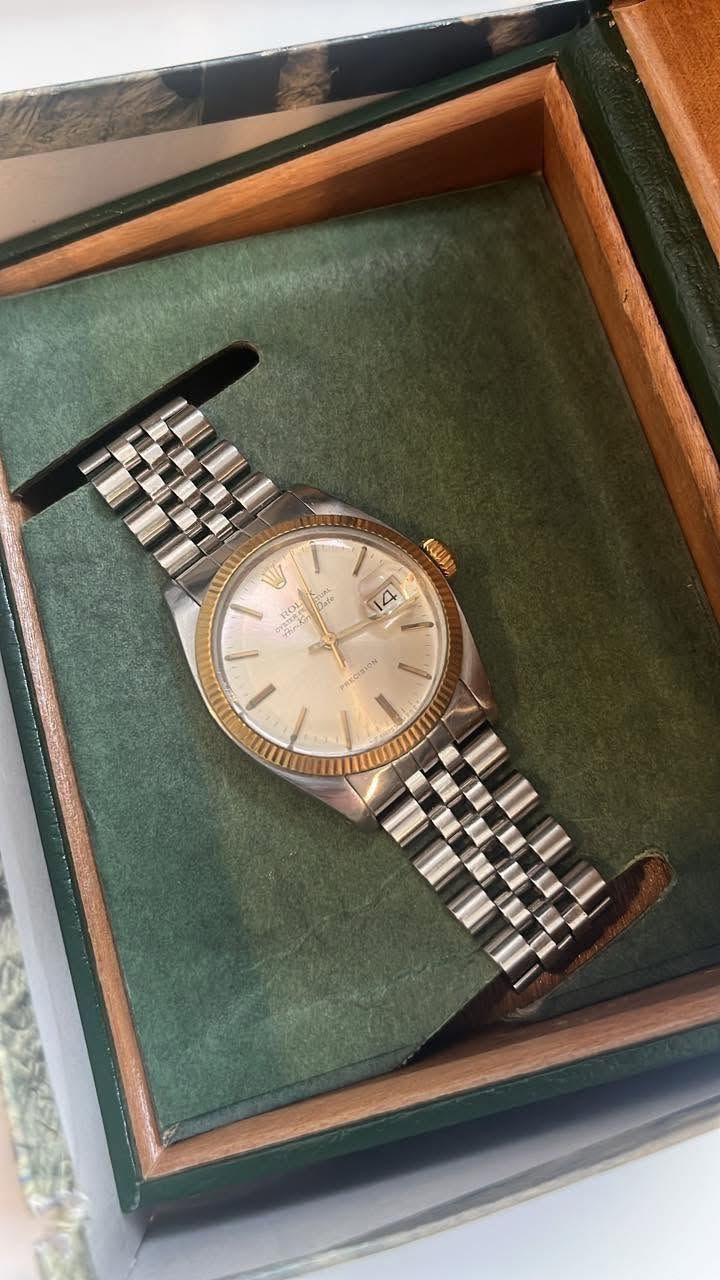 May be an image of wrist watch and text