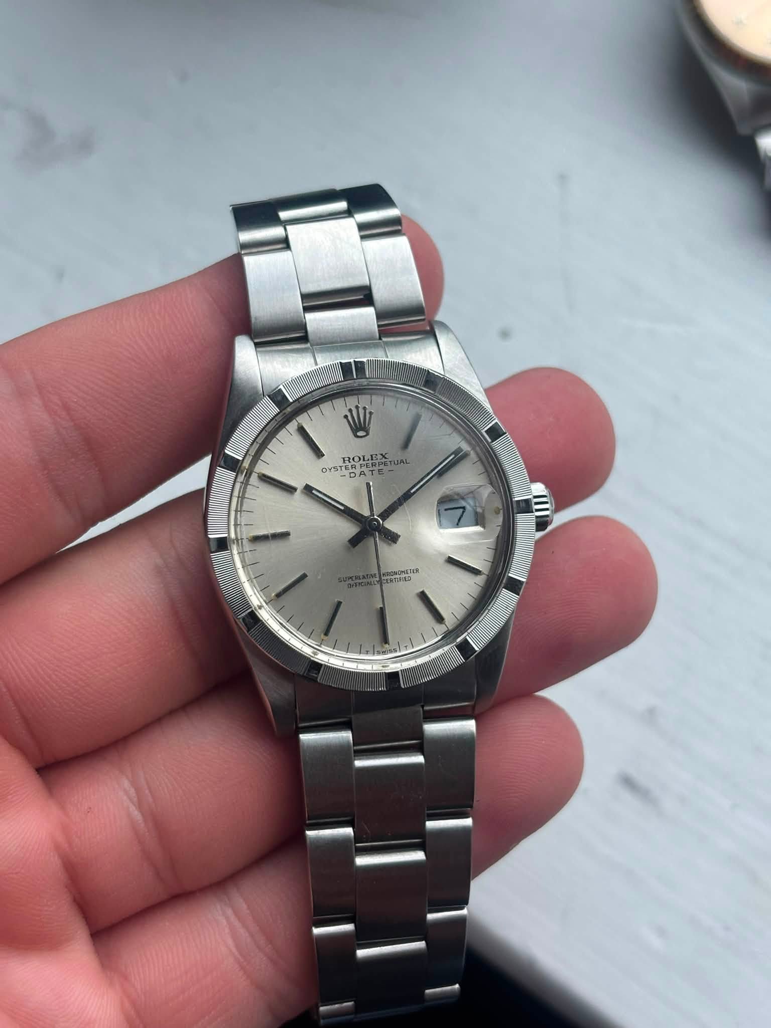 May be an image of wrist watch and text