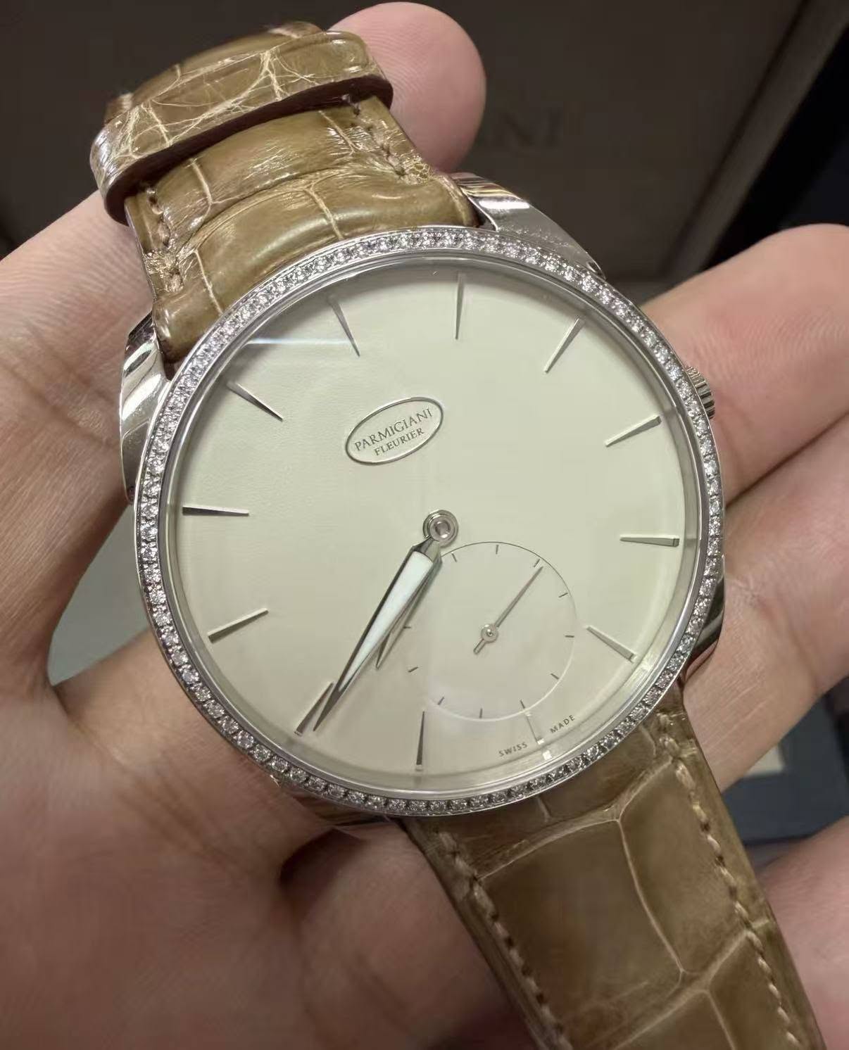 May be an image of wrist watch and text