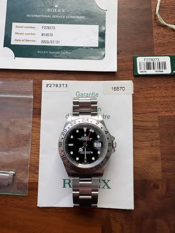 May be an image of wrist watch and text that says 'ROLEX INTERNATIONAL SERVICE GUARANTEE Serial number: F278373 Model Modelnumber: number: Date of Service: M16570 2023/07/21…