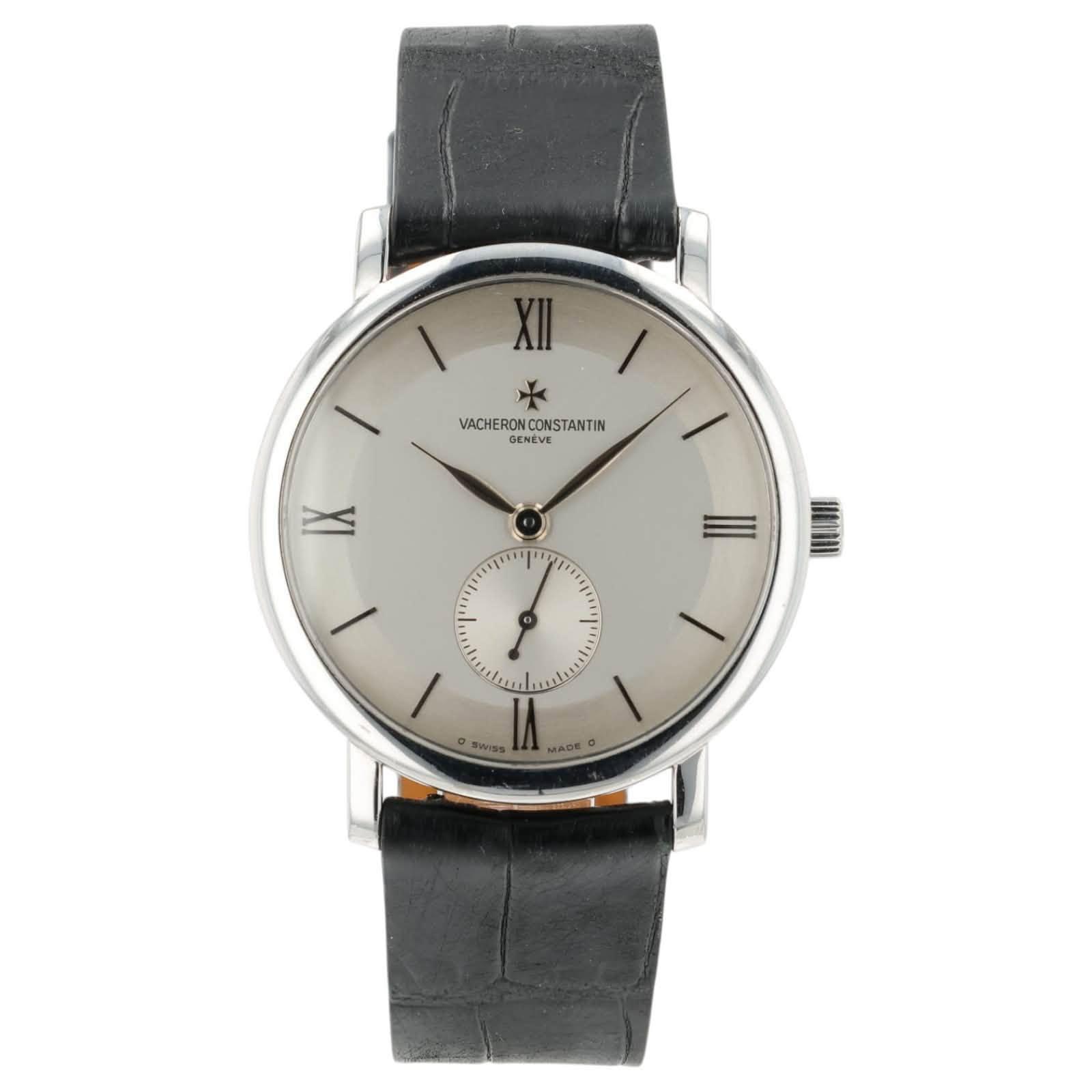 May be an image of text that says '١ VACHERON VACHERONCONSTANTIN CONSTANTIN GENEVE | IX קייןייי 1 o I IN SWISs MADE'