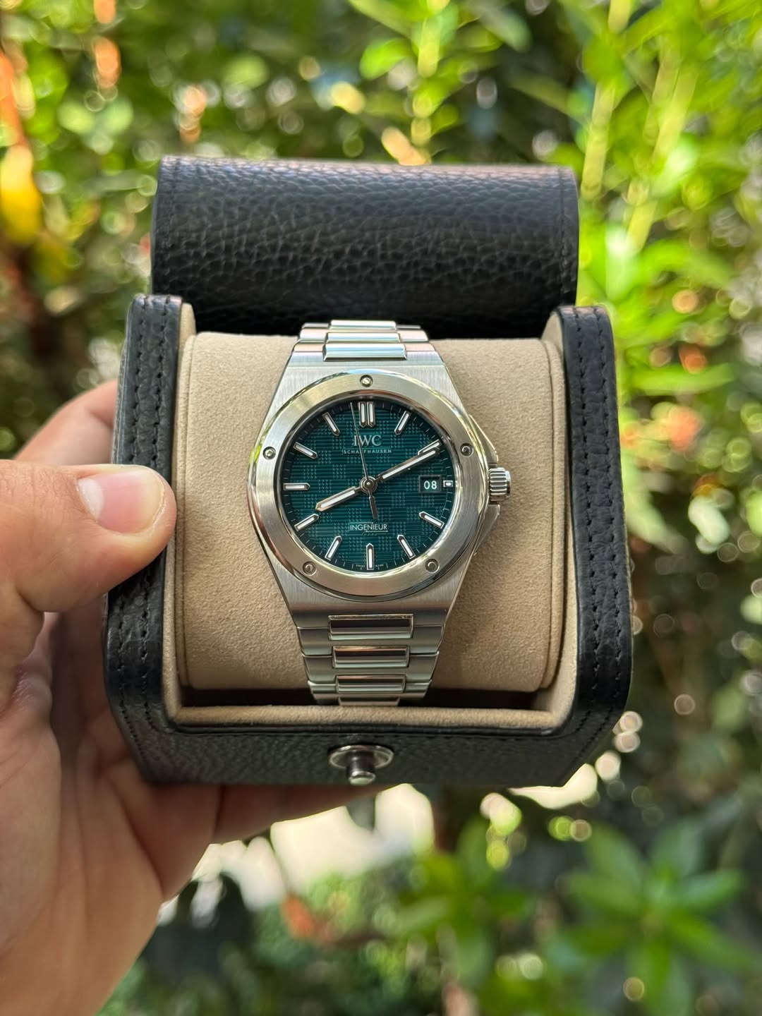 May be an image of wrist watch and text