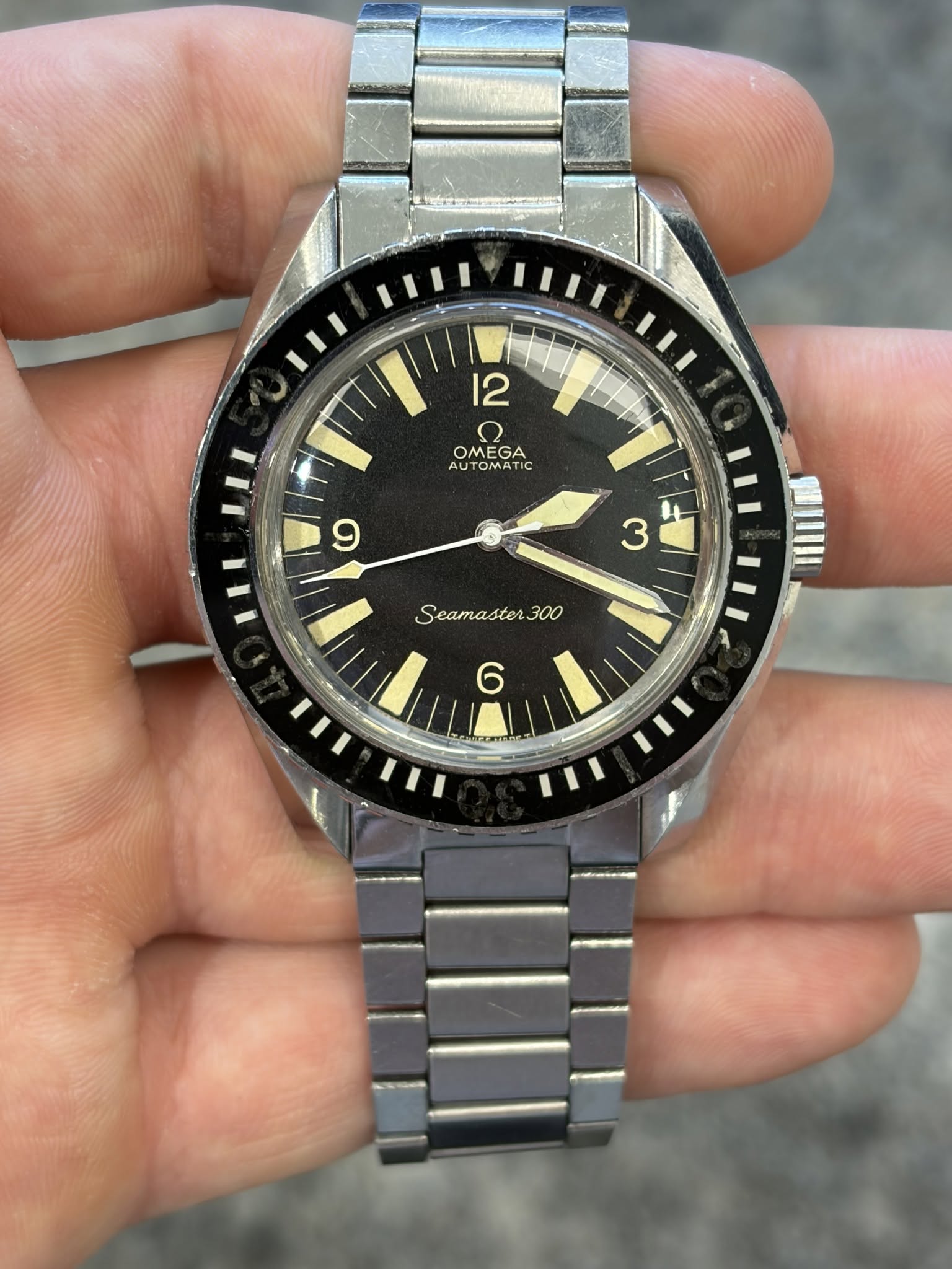 May be an image of wrist watch and text