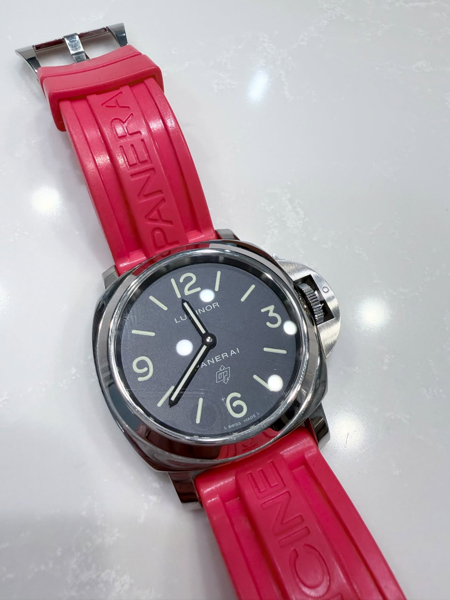 May be an image of wrist watch and text