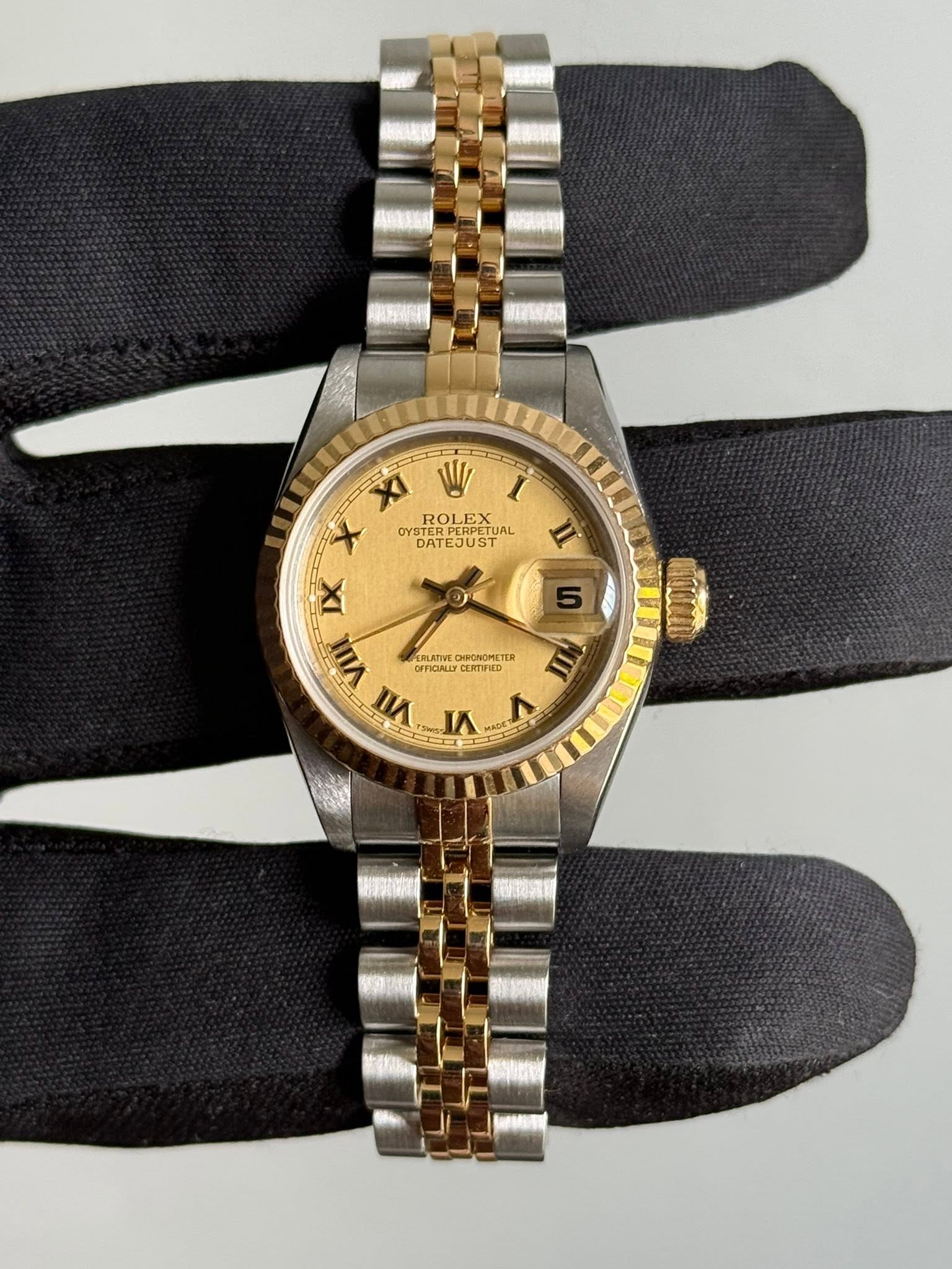 May be an image of wrist watch and text