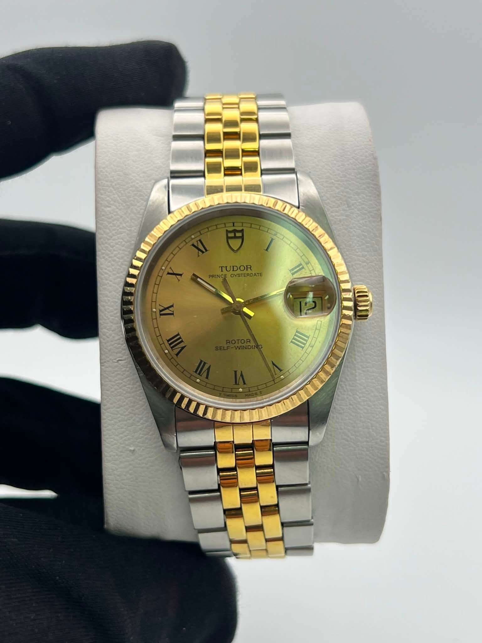 May be an image of wrist watch and text that says 'TUDOR.. TUDOR Te II UT ത IIII'