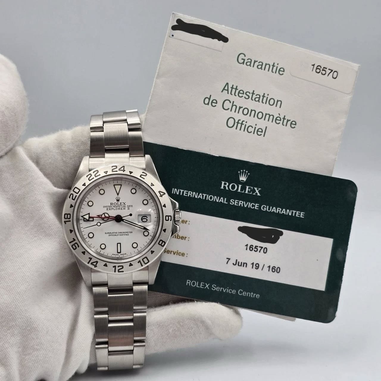 May be an image of wrist watch and text that says '16570 Garantie de Attestation Chronomètre Officiel 開置 ገ T OHESE LATE ER-LOREN INTERNATIONAL SERVICE GUARANTEE BOLEX o B တာ er: 6…