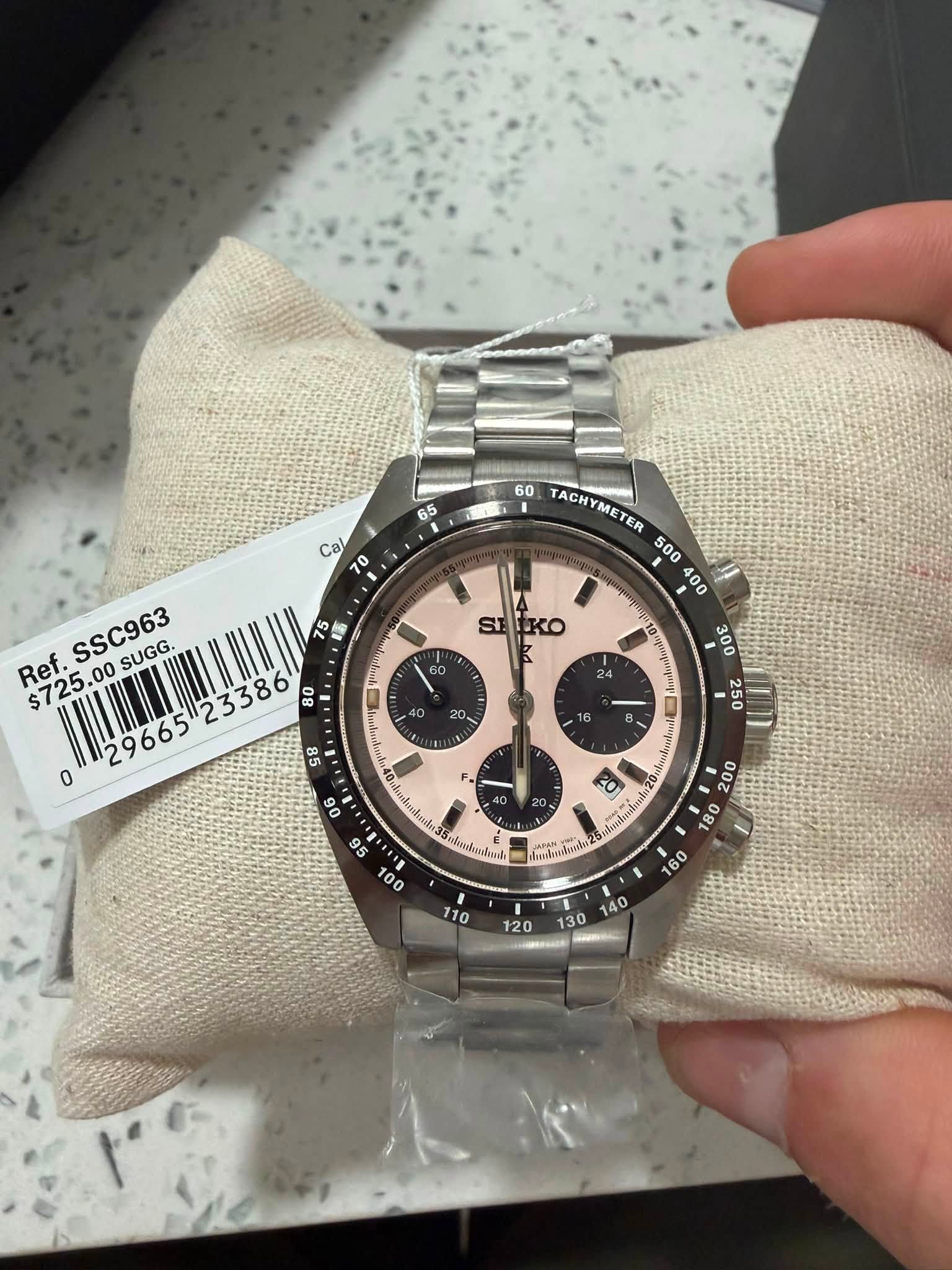 May be an image of wrist watch and text
