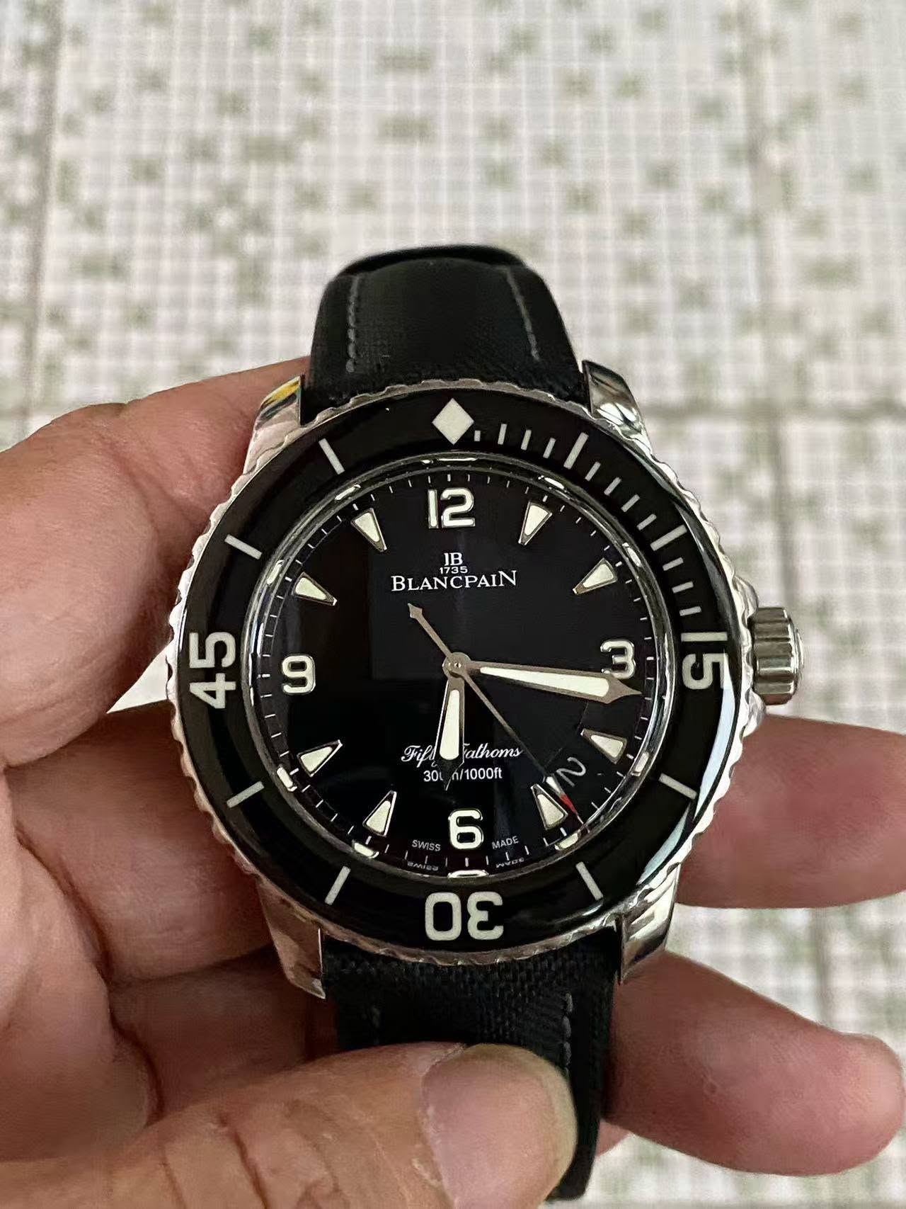 May be an image of wrist watch and text that says '12 IB BLANCPAIN 이자 9 45 3 Fifs 30 15 athoms ሰ/1000ቢ อีโหกระ 6 JADE I - σε'