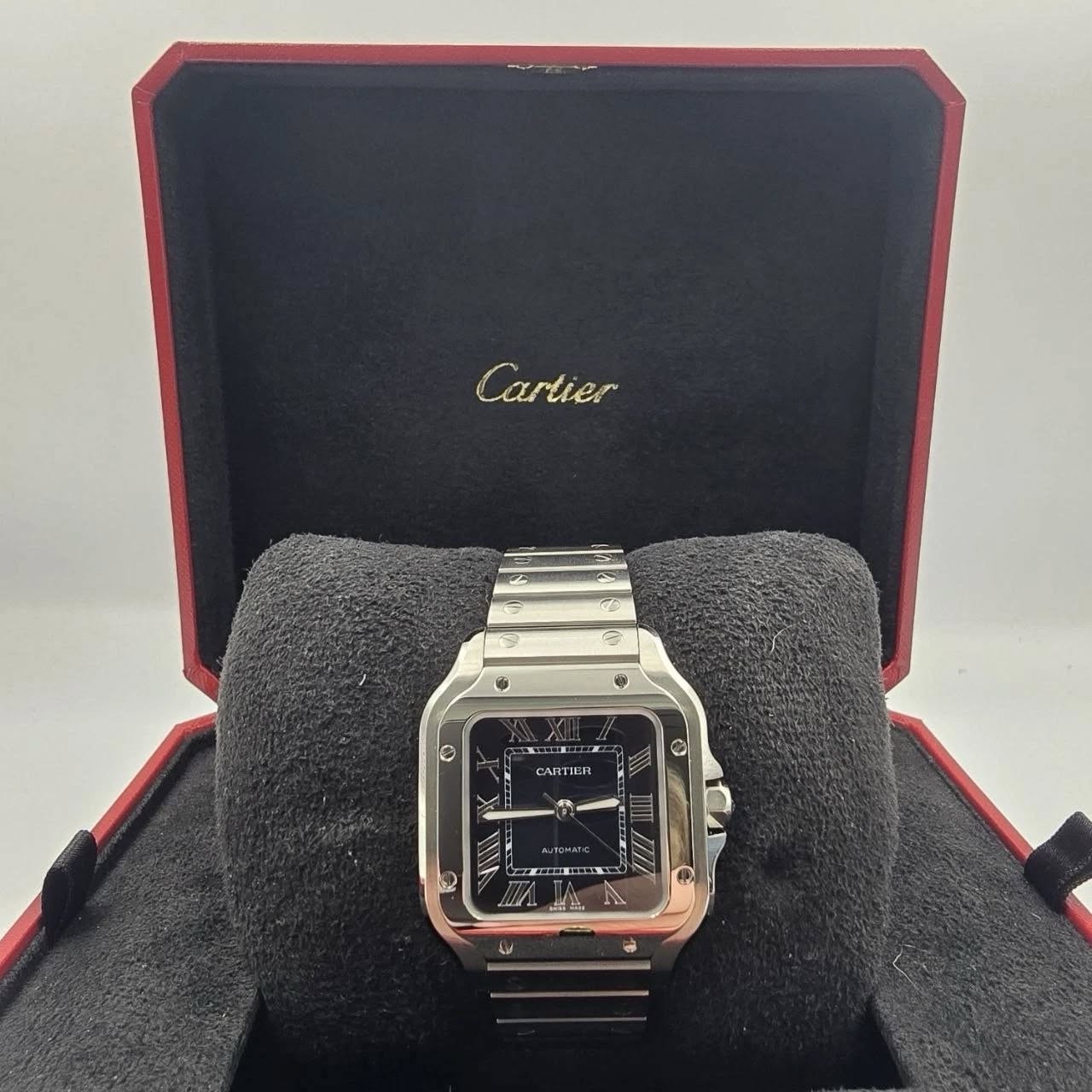 May be an image of digital watch and text that says 'ه Cartier 3 ® ® O CAITIE O'