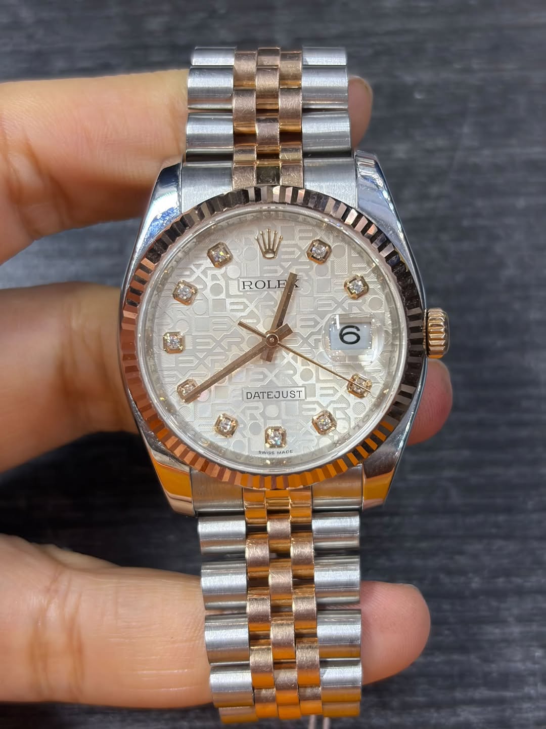 May be an image of wrist watch and text