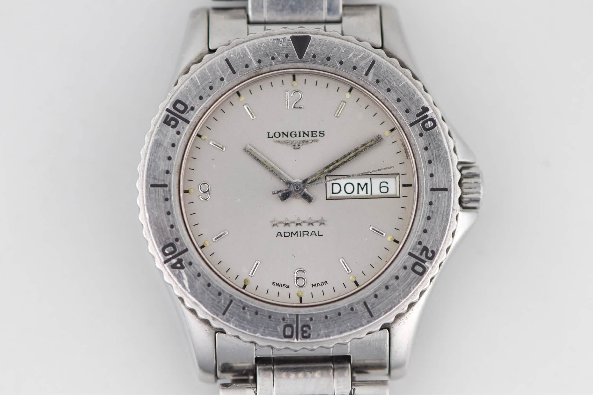 May be an image of wrist watch and text that says 'I 12 50 ١ LONGINES 박인하 9 DOM 6 KЖЖЖR. ADMIRAL ၁ 40 AT I SWISS MADE 20 310'