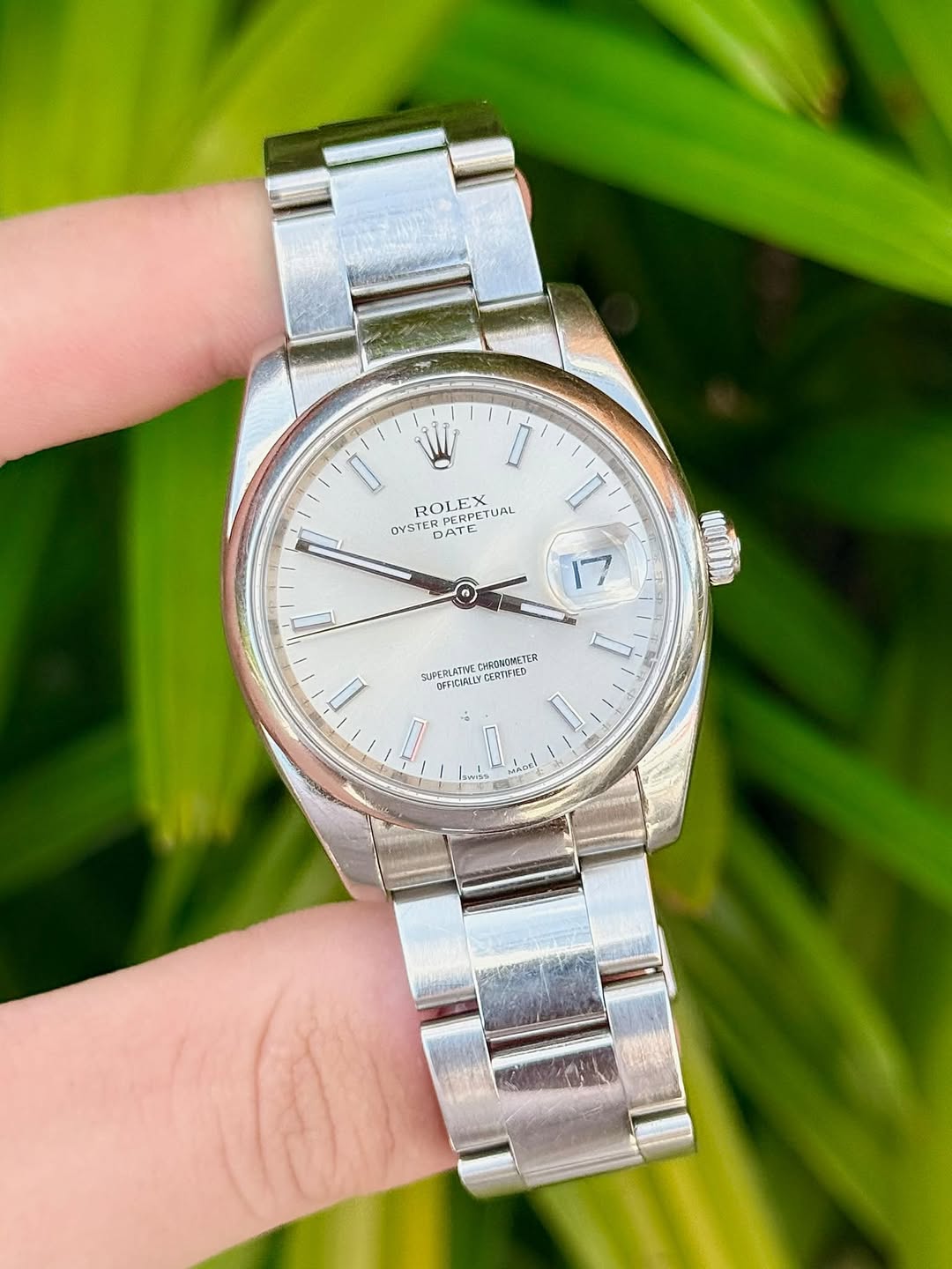 May be an image of wrist watch and text