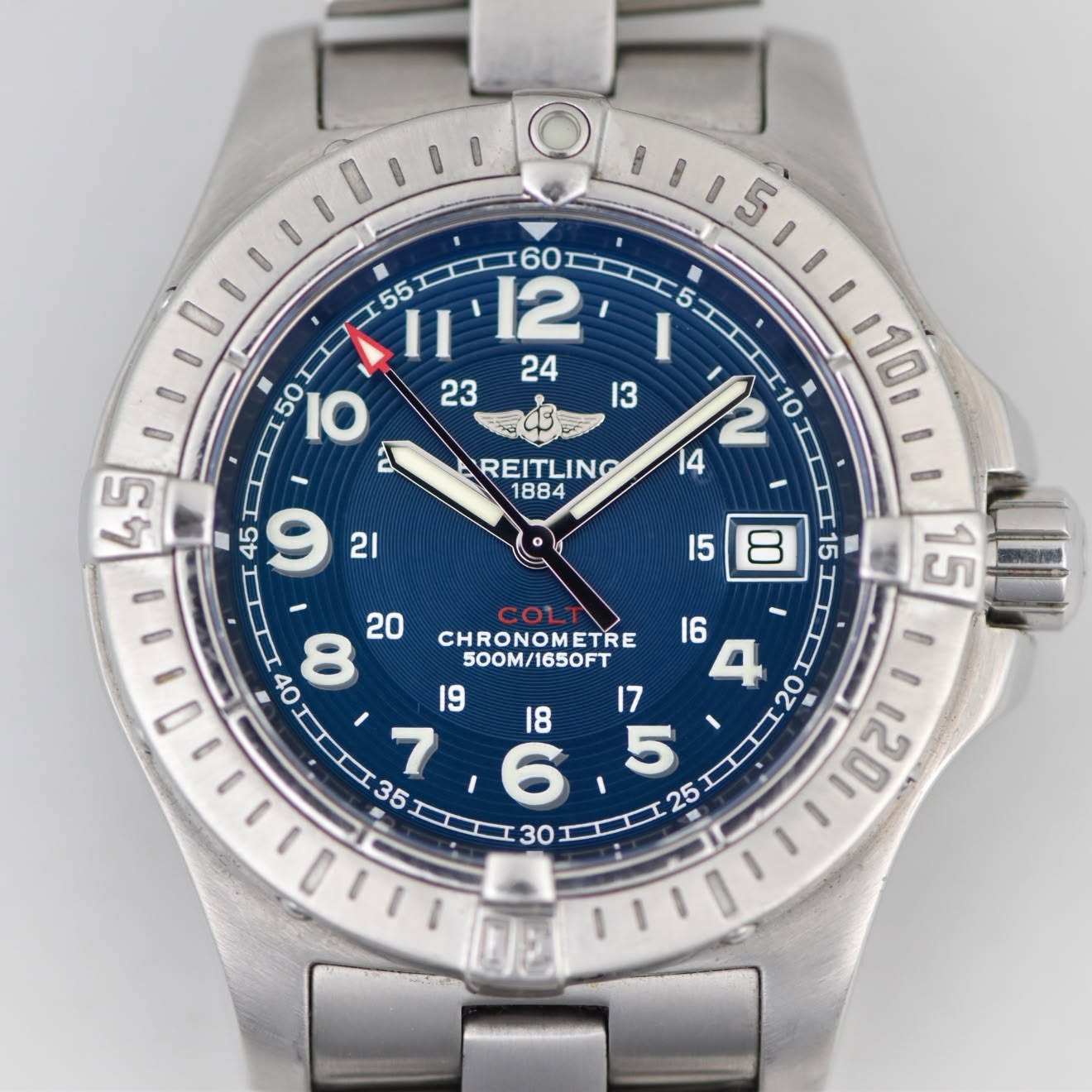 May be an image of wrist watch and text that says '0 60 55 I I1'2 O 0115111 I IO 23 I3 10 2 10 I 14 I I 45 REITLING 無 20 I CHRONOMETRE 500M/1650FT I : IIDI'