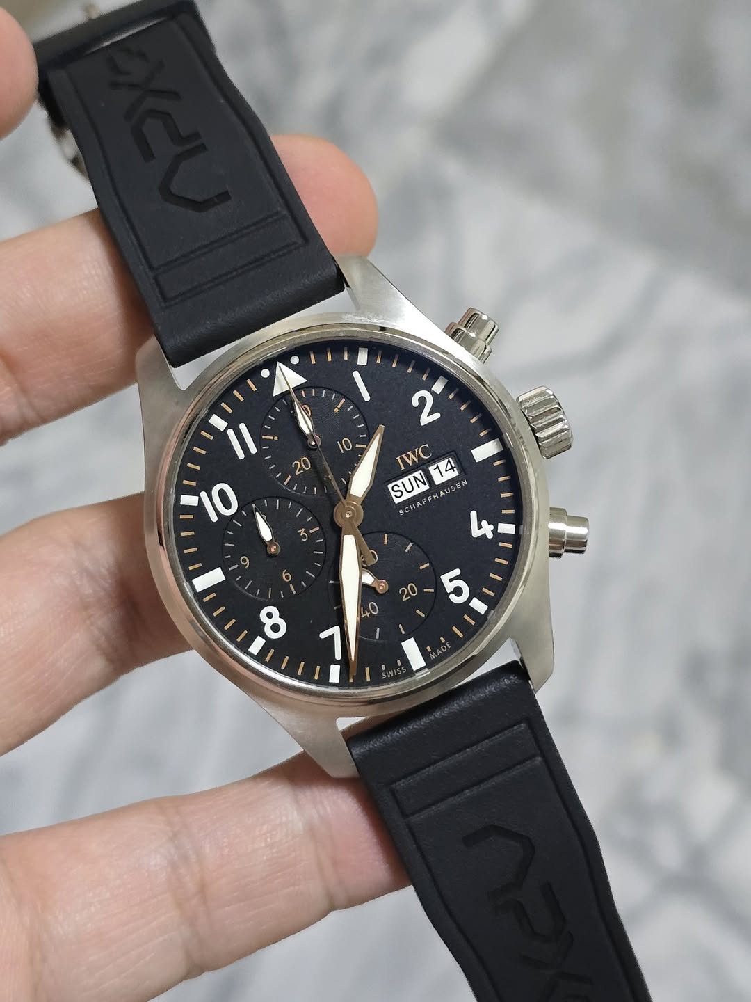 May be an image of digital watch and text that says '• IWC 14 SUN SCHAFEY บรรพ 4 る 1 9 6 8 © '