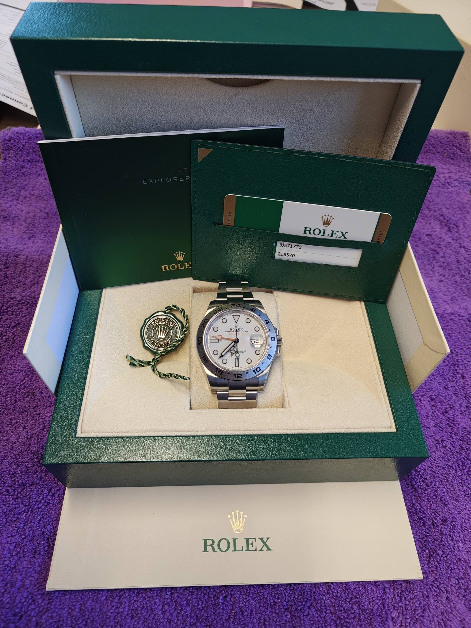 May be an image of wrist watch and text that says 'Wi ROLE ROL ROLEX EX 315717T0 216570 V O Ο O E ROLEX'