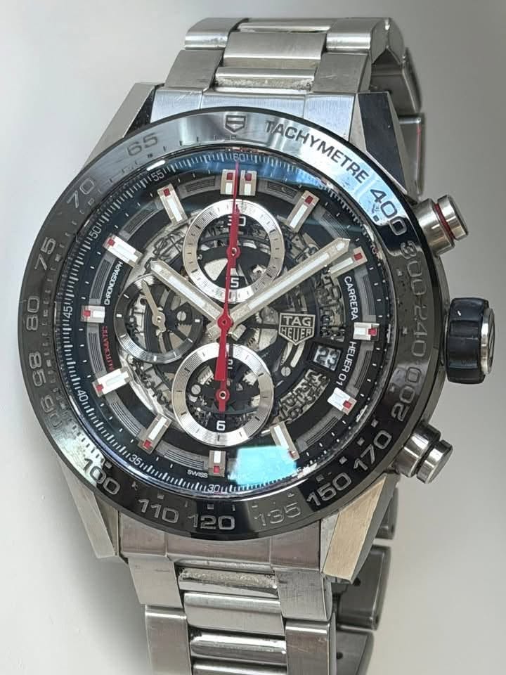 May be an image of wrist watch and text