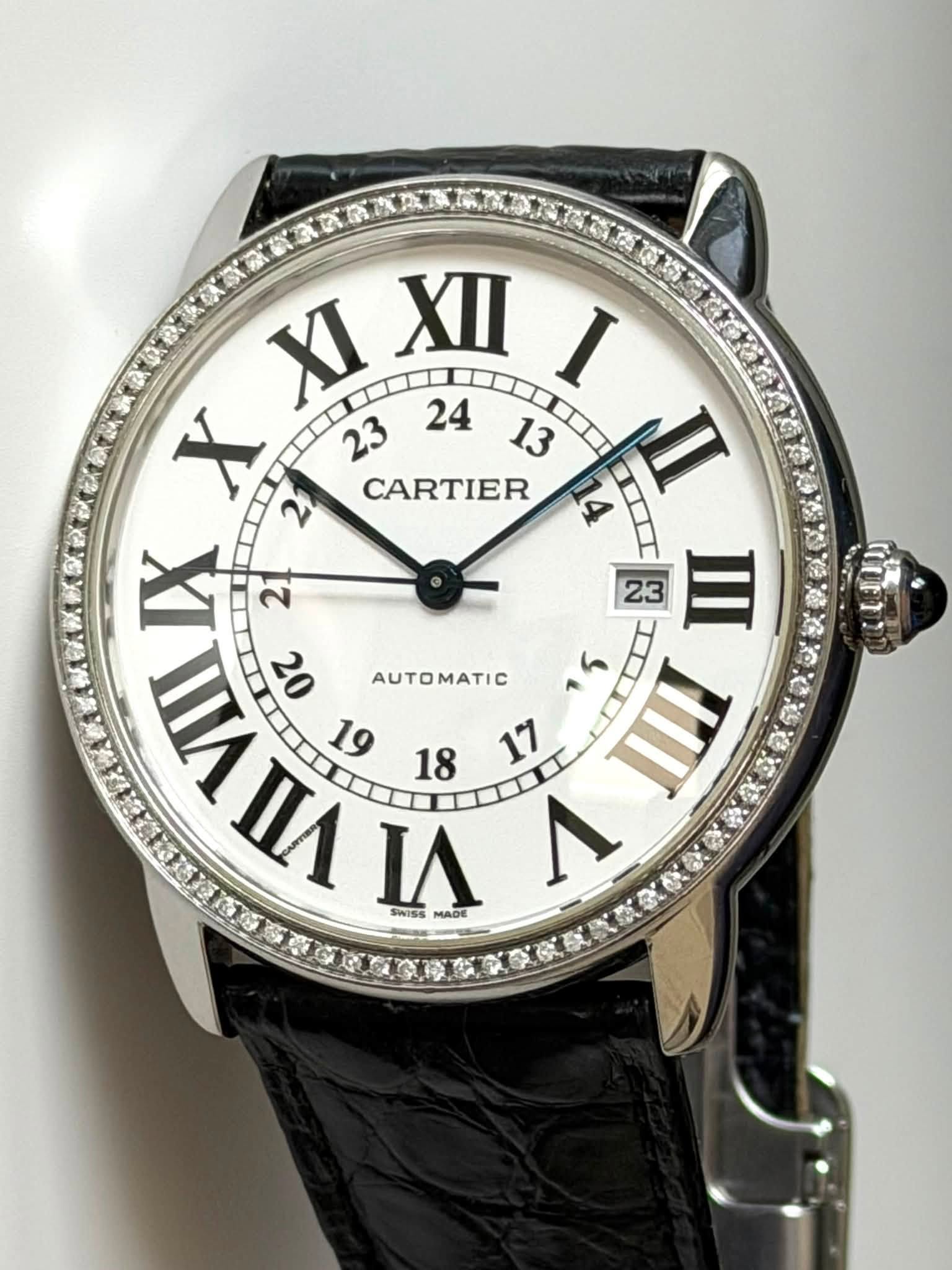 May be an image of wrist watch and text that says 'XI XII I X CARTIER 14 n 7 2 23 IIII nИnA ΠЛ M MADE WA 20 ATI ん IIN SWISS'