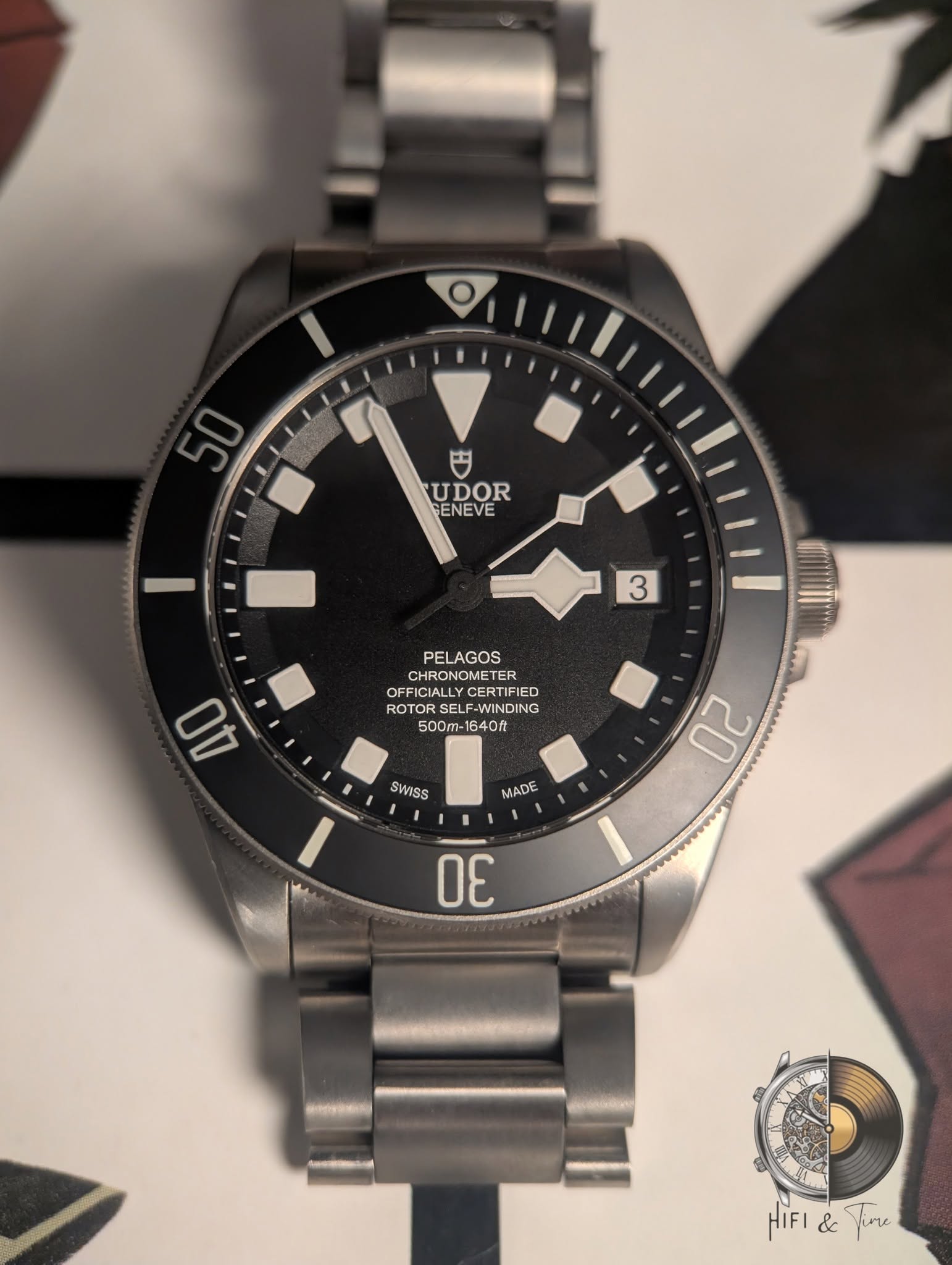 May be an image of wrist watch and text that says '50 円 UDOR GENEVE 3 3 PELAGOS CHRONOMETER ETER OFFICIALL OFF YCER YCERT IFIED CERTIFIED ED ROT ROTOR SELF-WINDI F-WINDING DING…