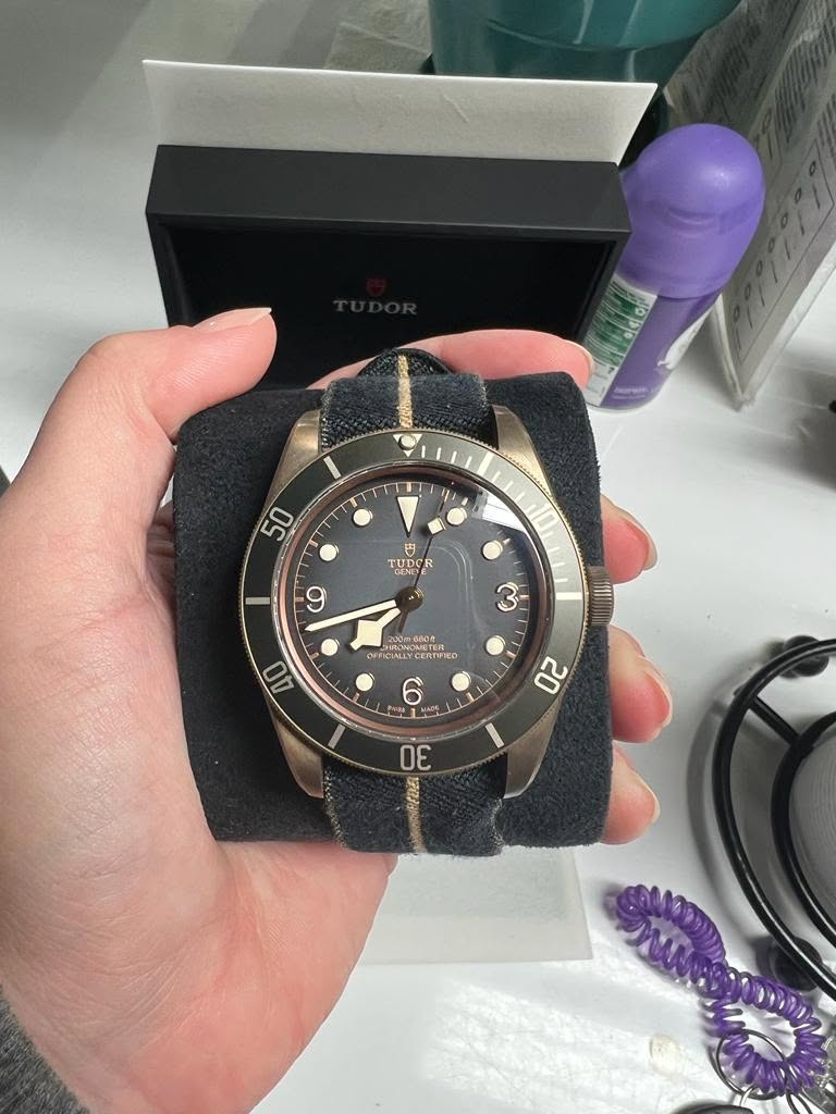 May be an image of wrist watch and text