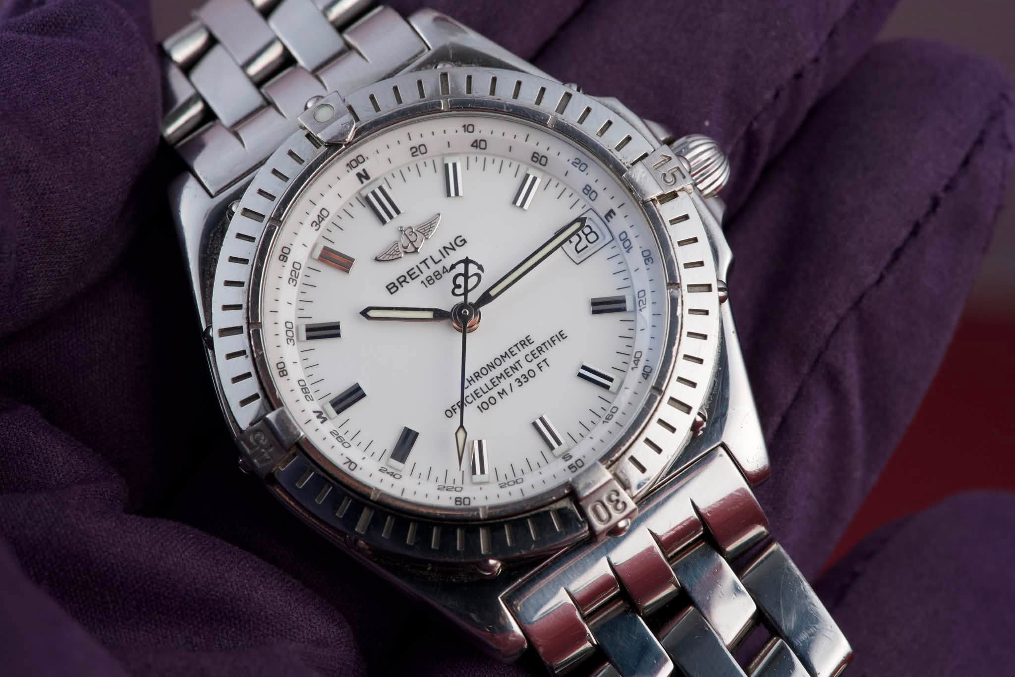 May be an image of wrist watch and text that says '20 100, ויויוין BREITLING ING 1884 B 300 80 |సి 120 4O 0BO M HRONOMETRE CERTIFIE CIELLEMENT CLLEMENT M/ 330 FT OF 100 Il. 160…
