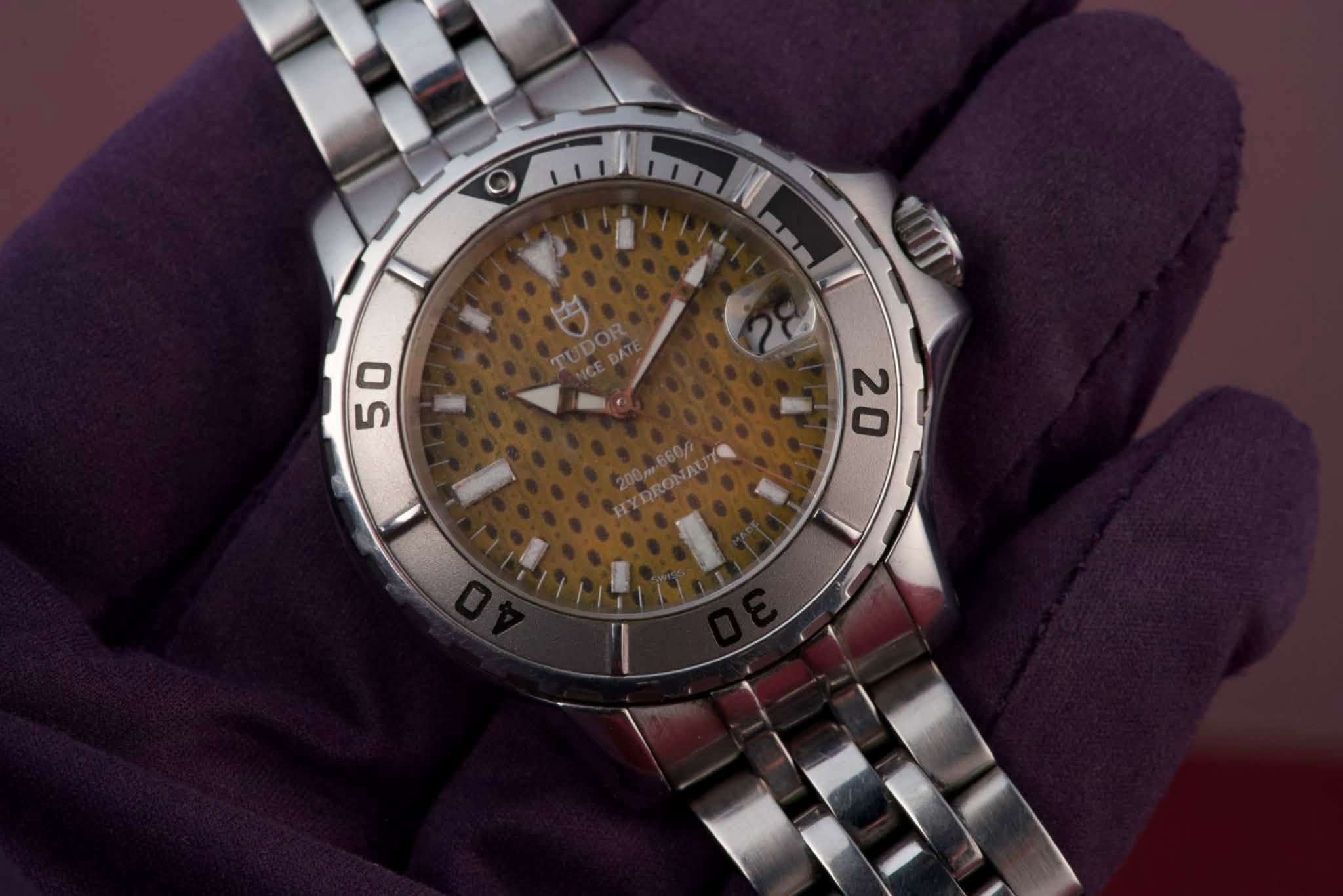 May be an image of wrist watch and text