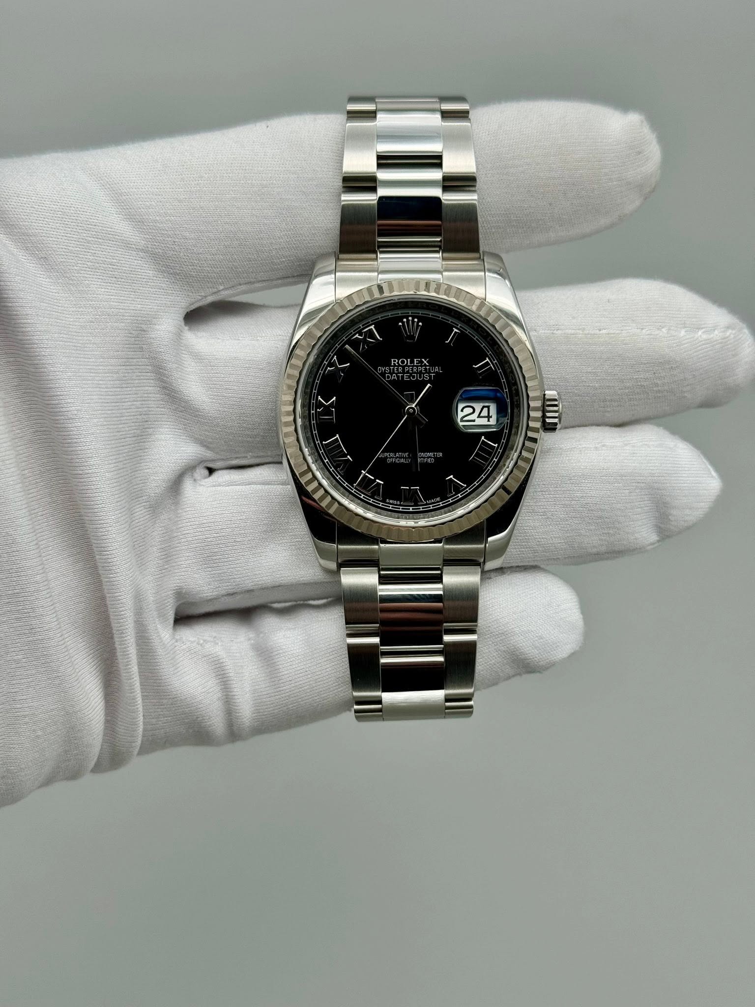 May be an image of wrist watch and text