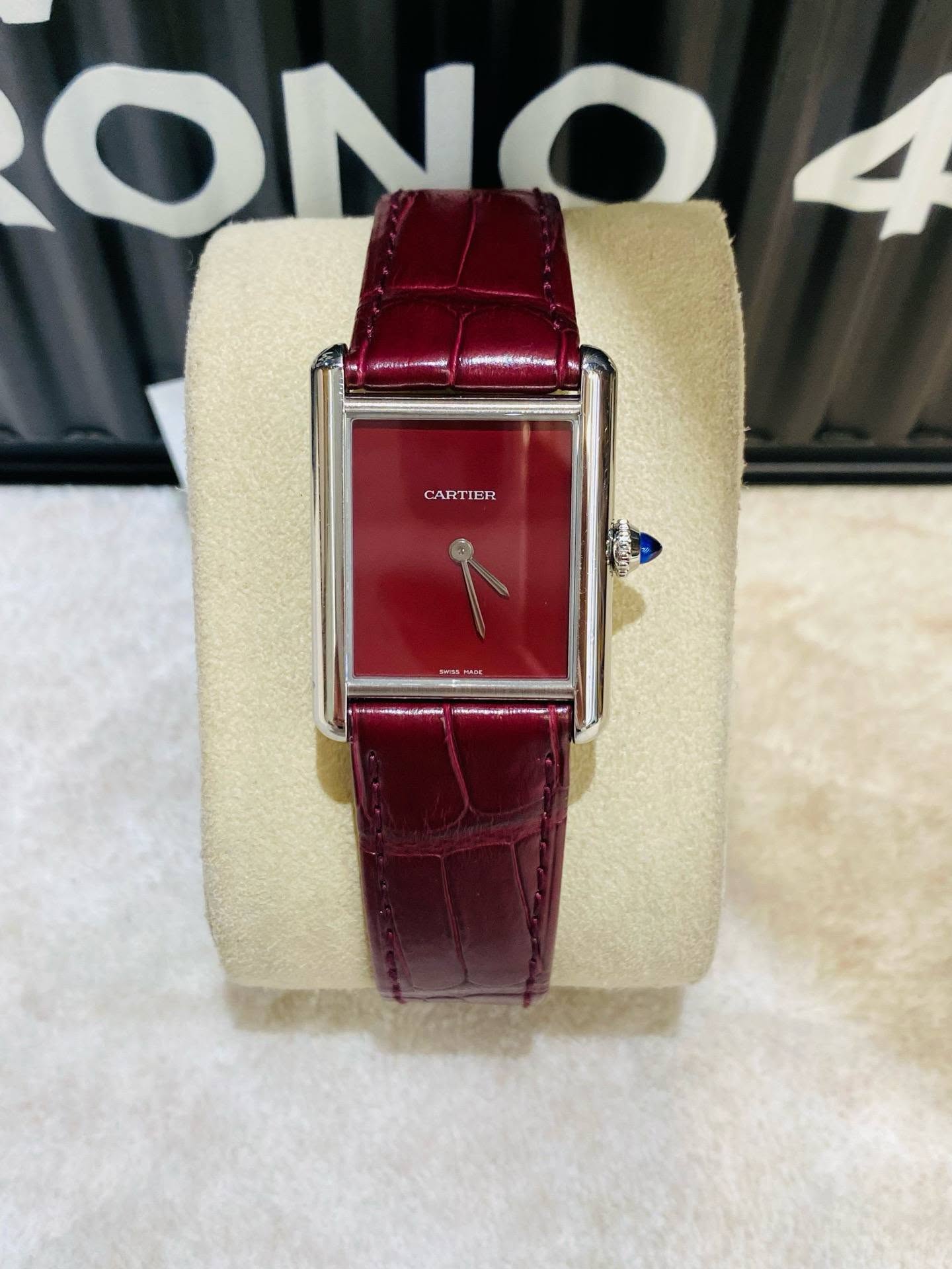 May be an image of wrist watch and text